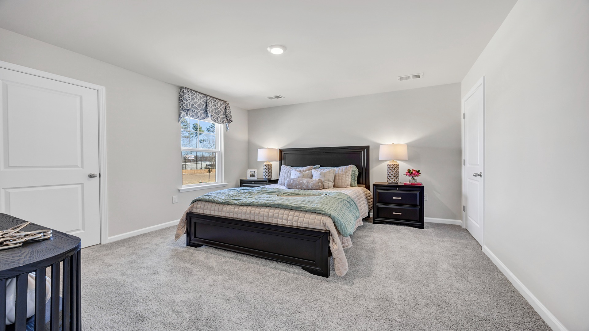 Bedroom 4 upstairs with carpet and a window