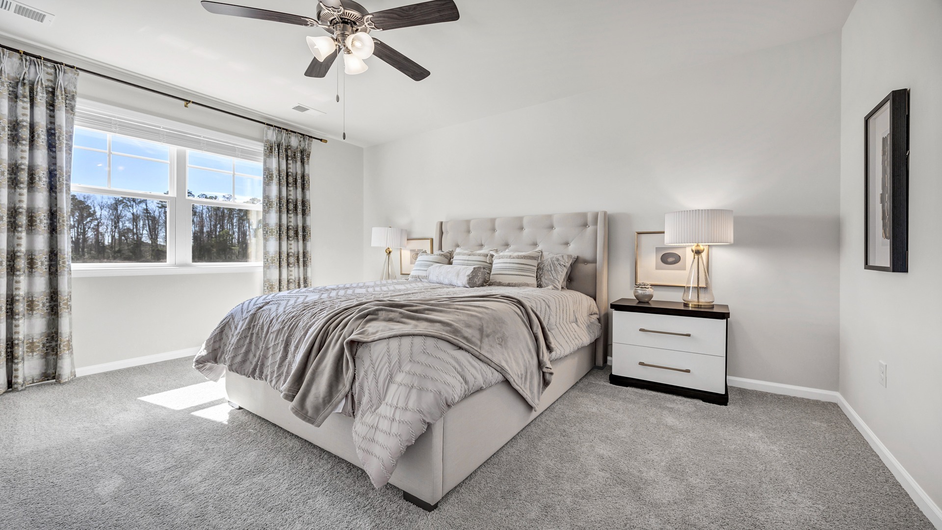 Primary bedroom comfortably fits a queen or king bed set