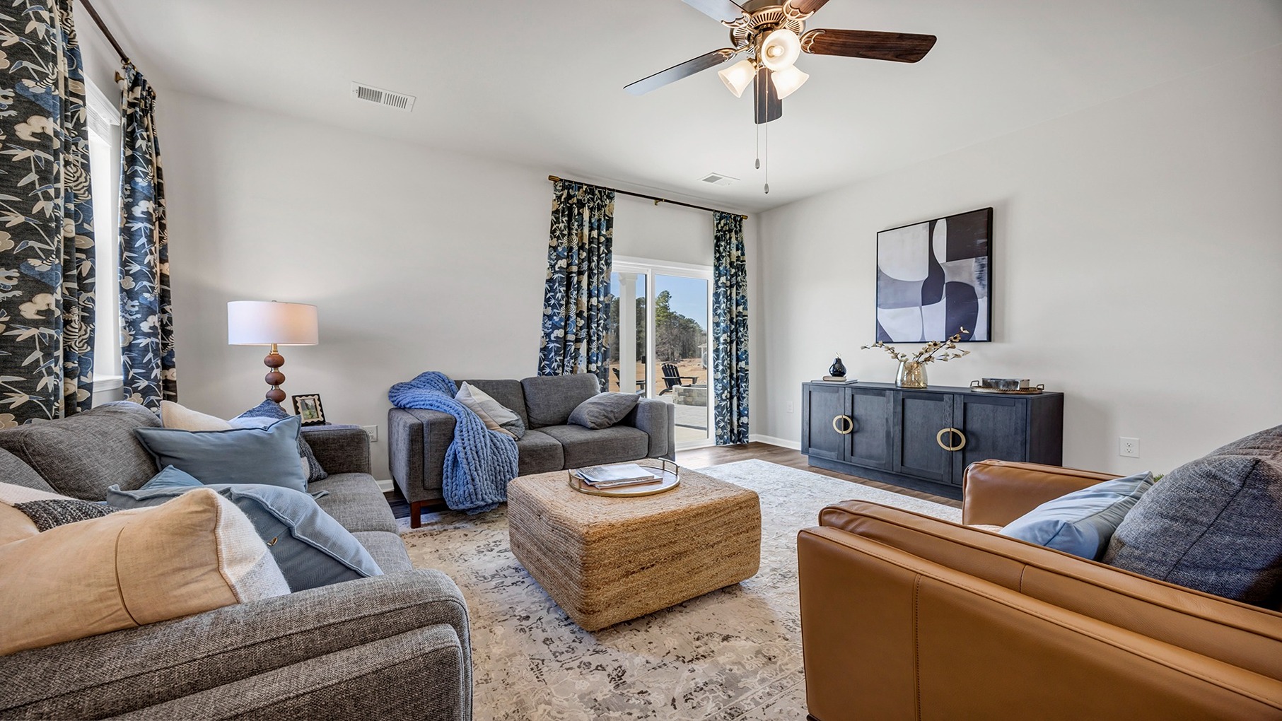 Manning living area with several windows