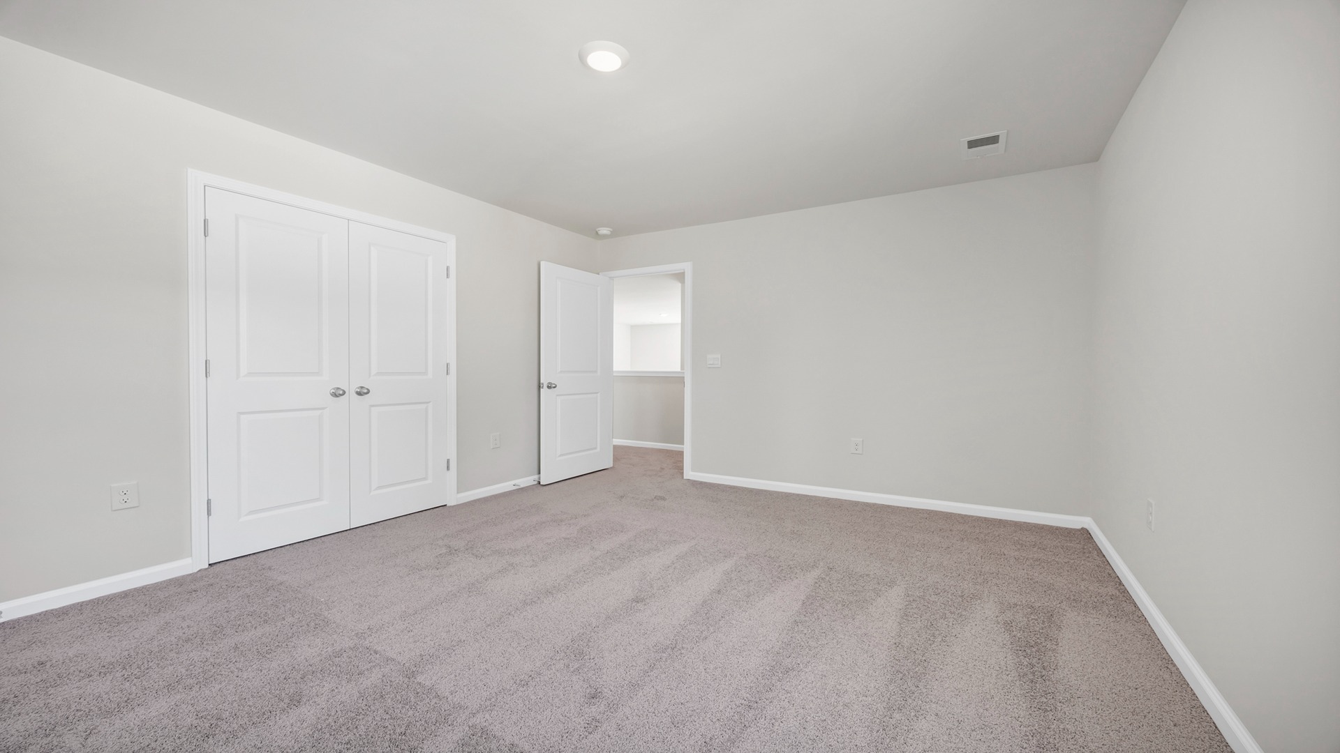 Bedroom 3 is carpeted and located upstairs.