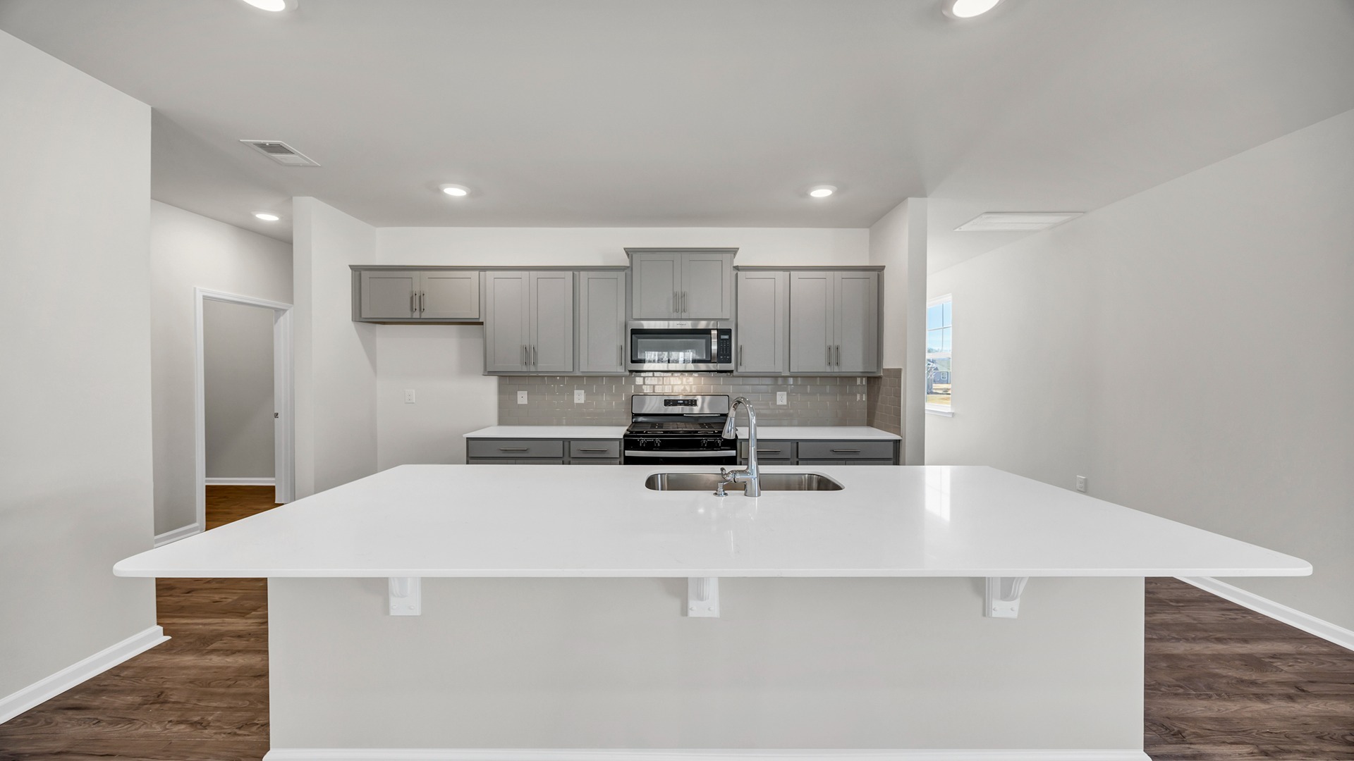 There is room for barstool seating at the floating kitchen island.