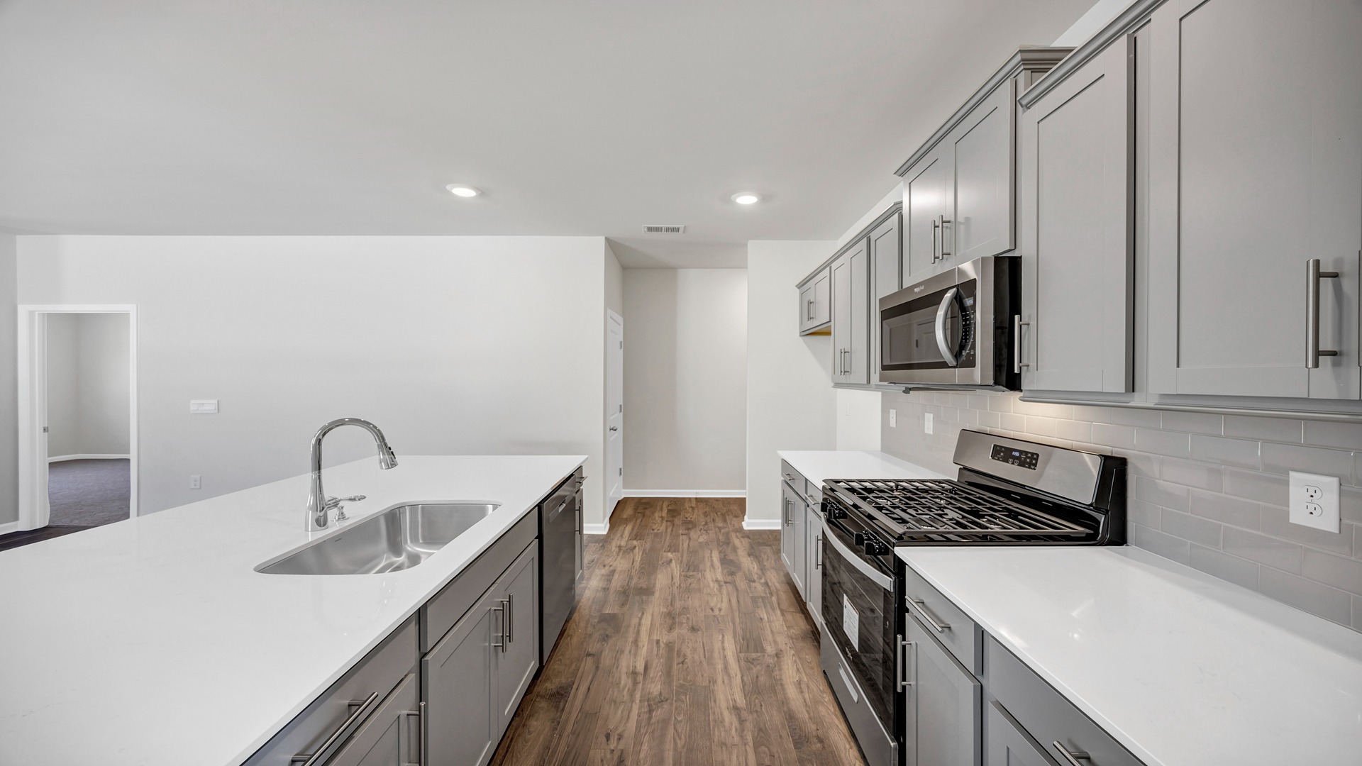There is also tile backsplash in the kitchen.