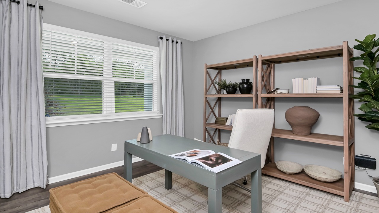 First-floor flex space off the front foyer staged as an office space