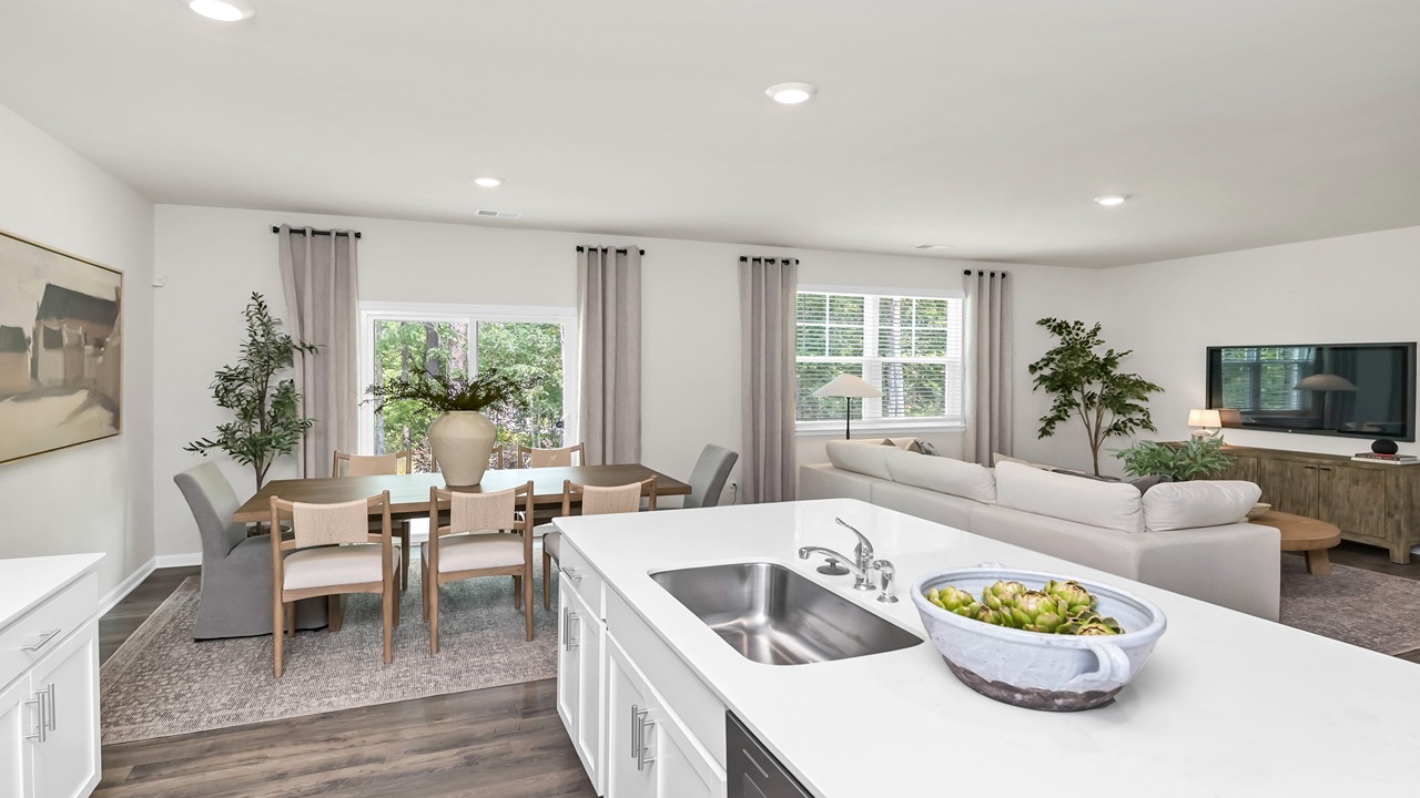 Open concept kitchen and dining areas of the Hayden floorplan with natural light