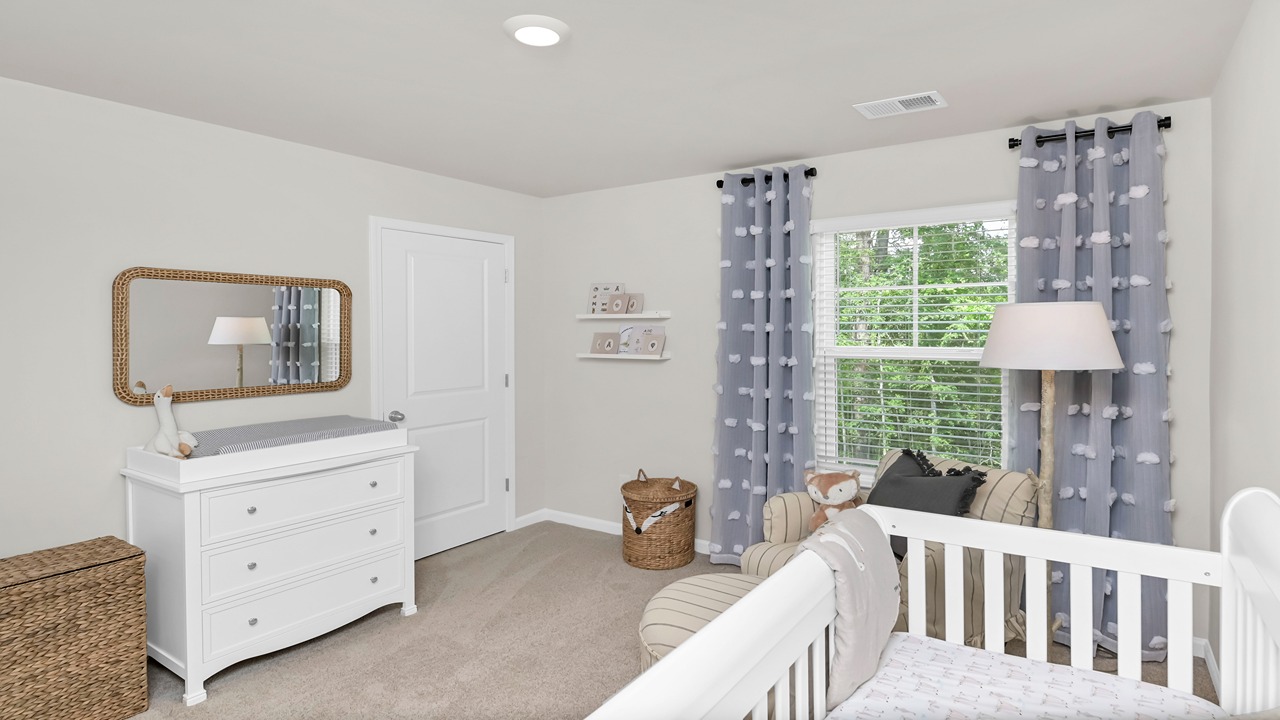 Bedroom 5 usptairs with window and carpet floors