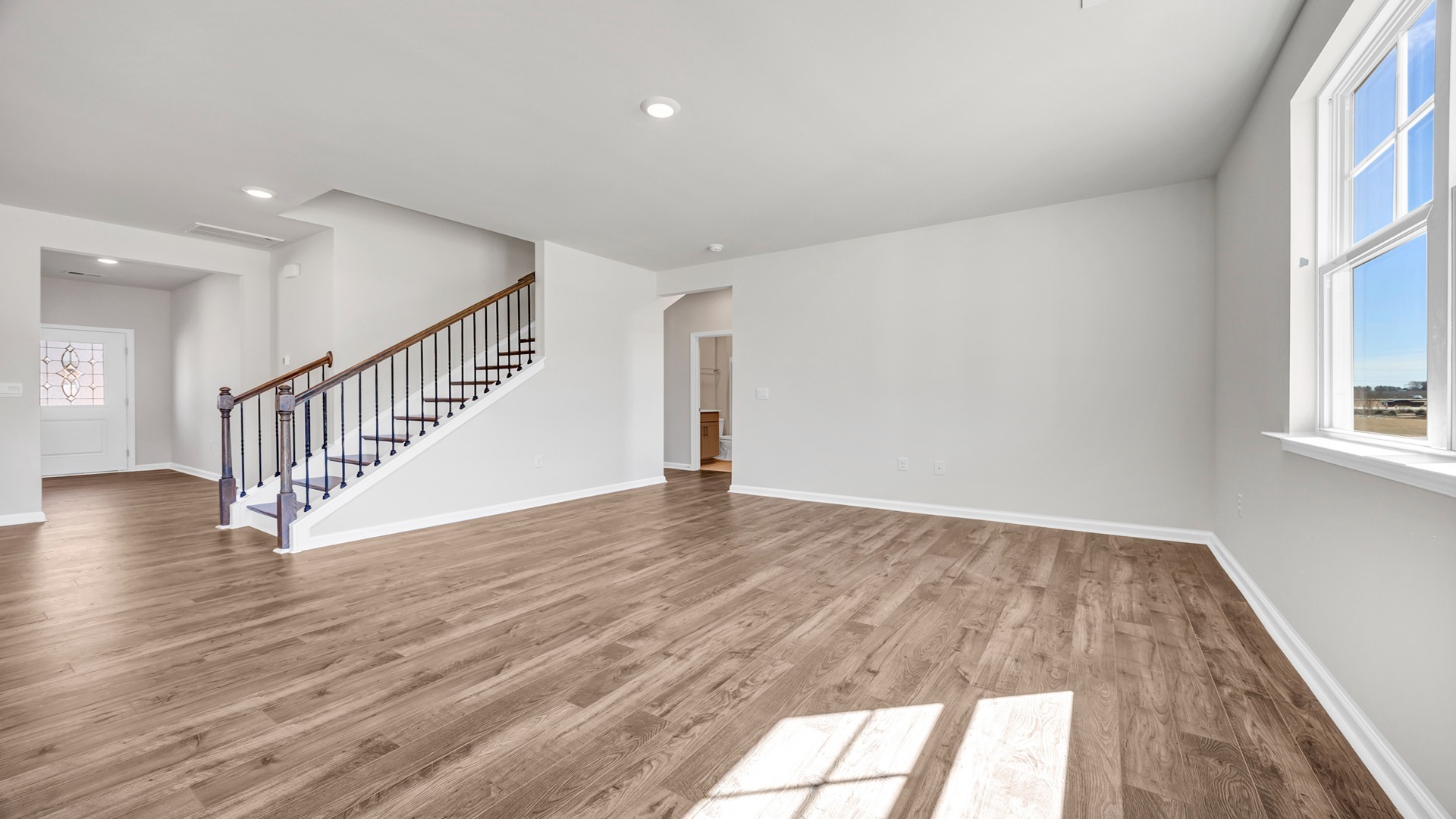 Living area leads to access to downstairs bedroom