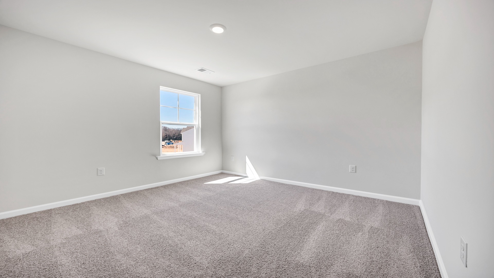 Bedroom 4 upstairs with carpet flooring and a window