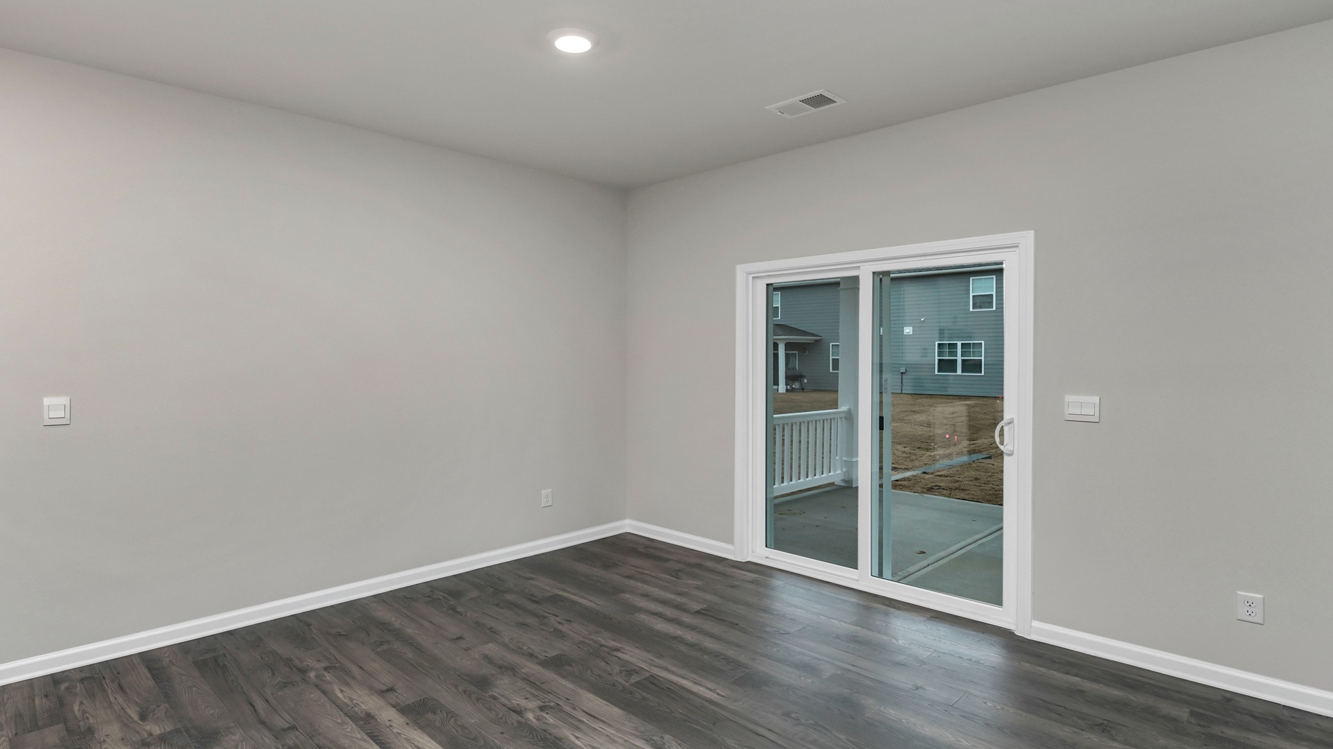Access to back patio through glass sliding doors in the dining area