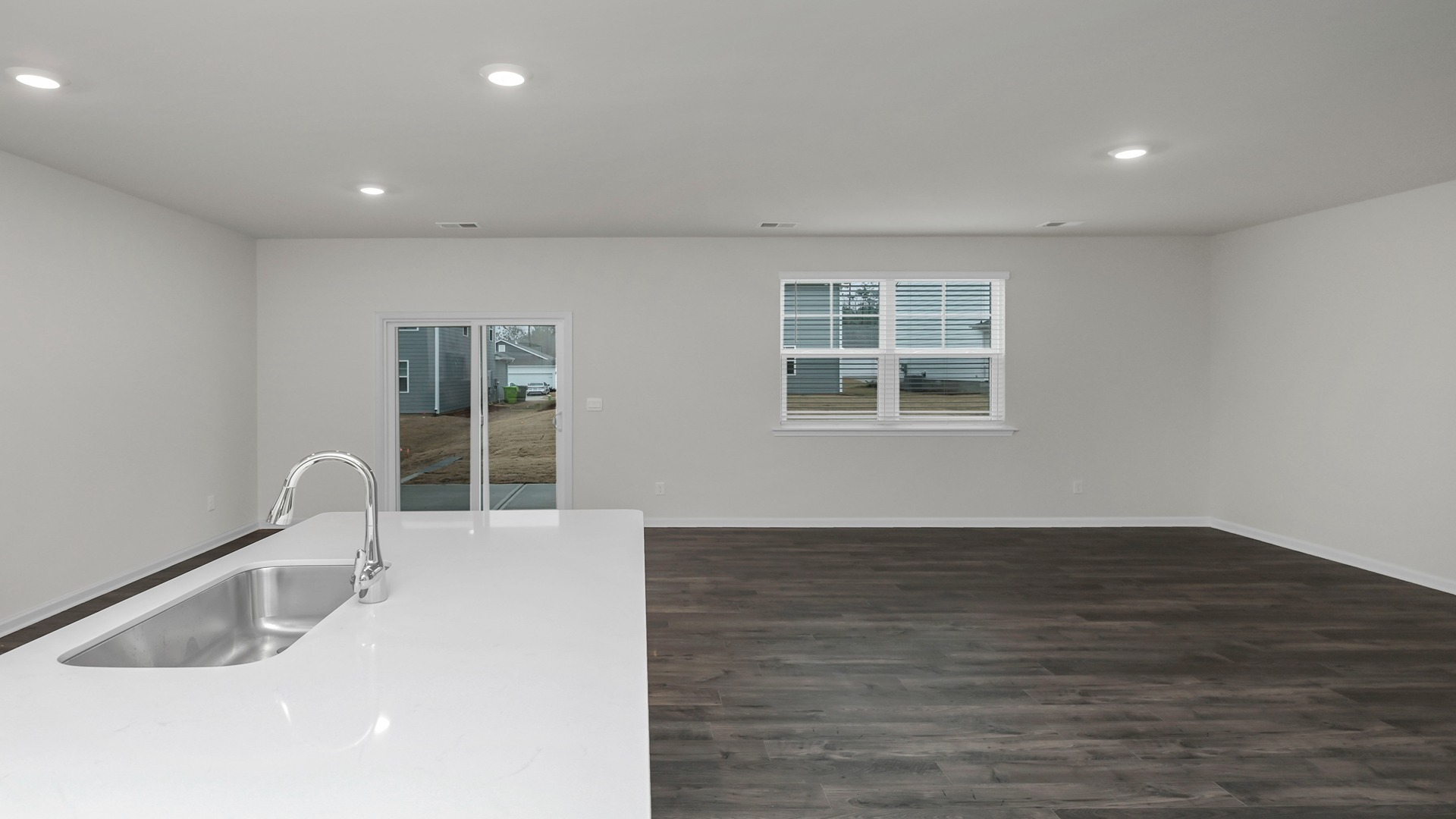 Open concept kitchen, dining, and living areas in the Elle