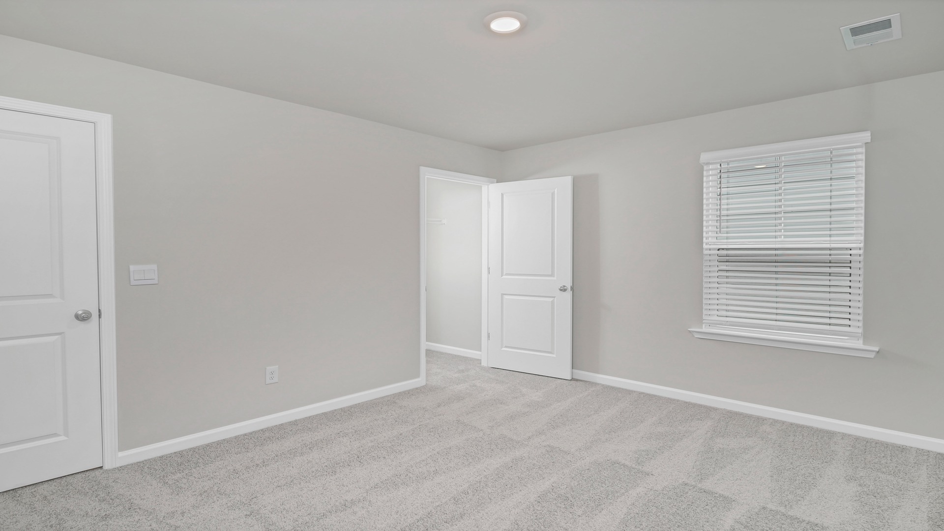 Bedroom 2 upstairs with carpet flooring and windows