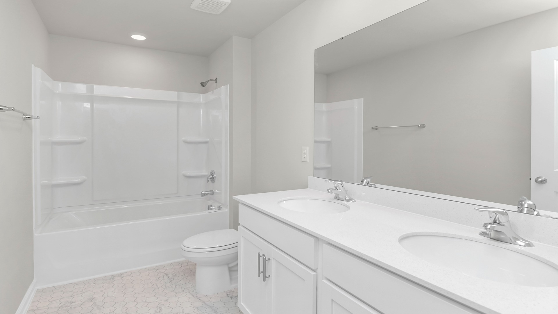 Bathroom 2 upstairs with a double vanity and shower tub combo