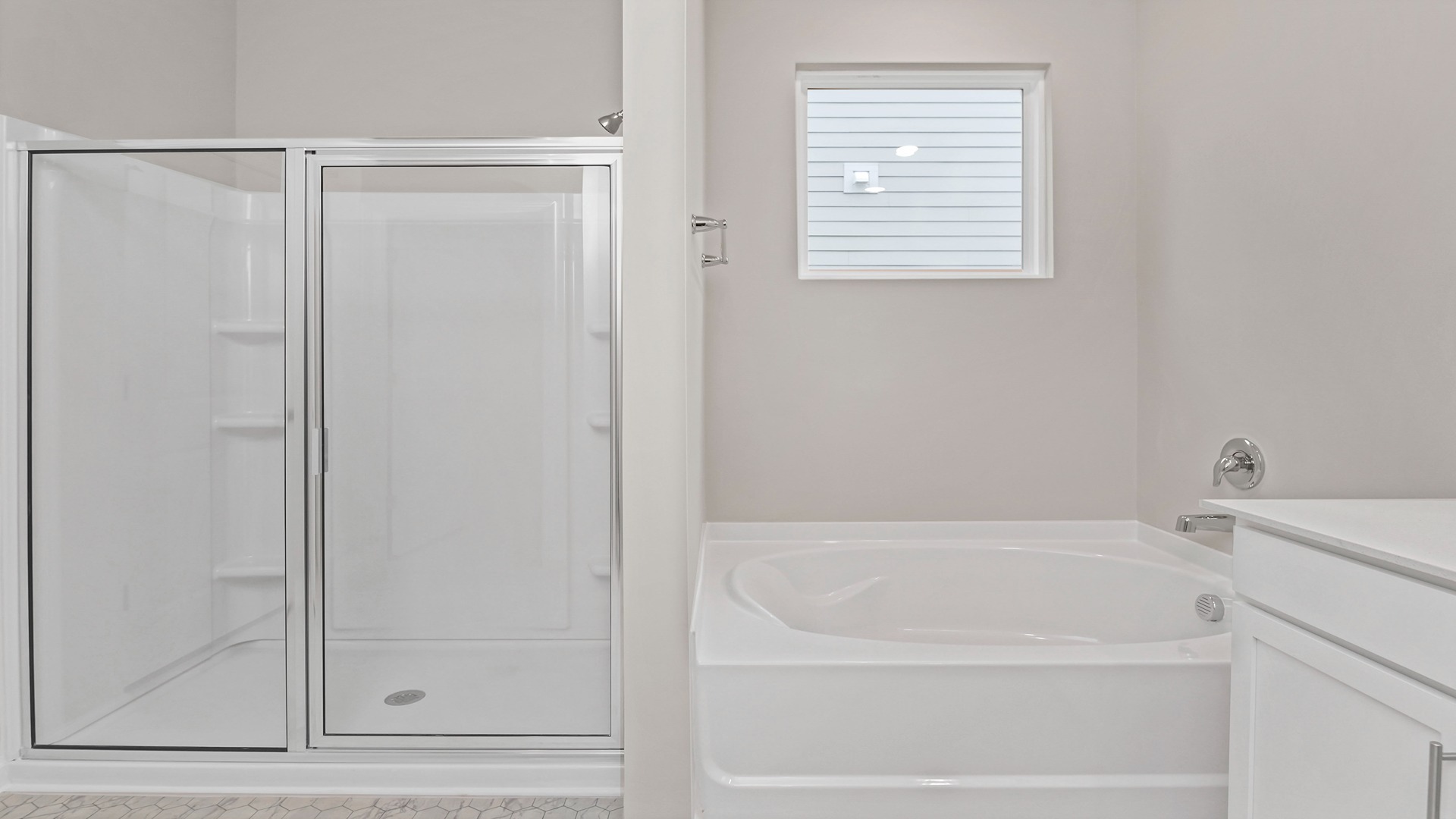 Primary bathroom with a standup shower and garden tub