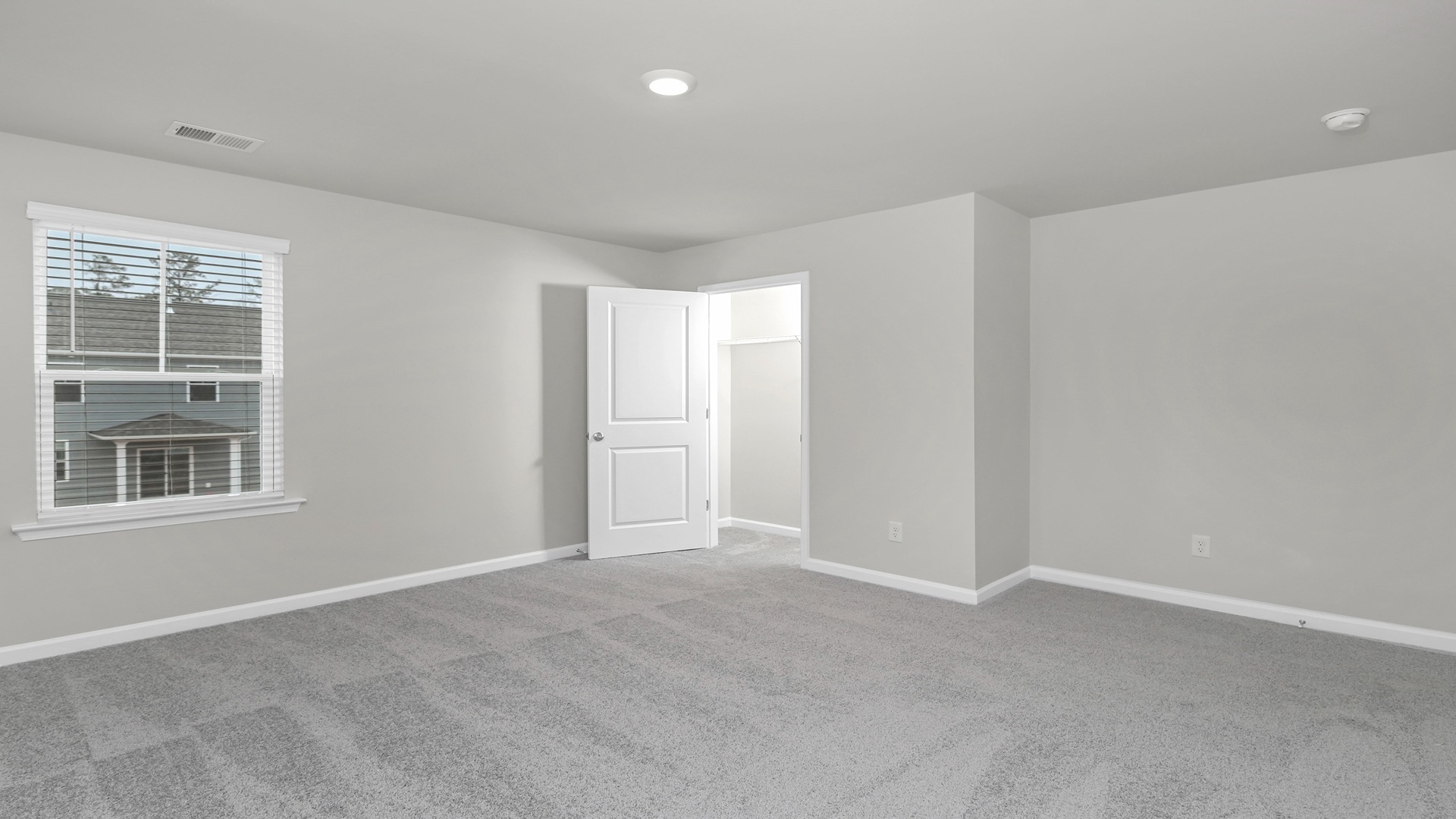 Bedroom 5 with carpet flooring and a window