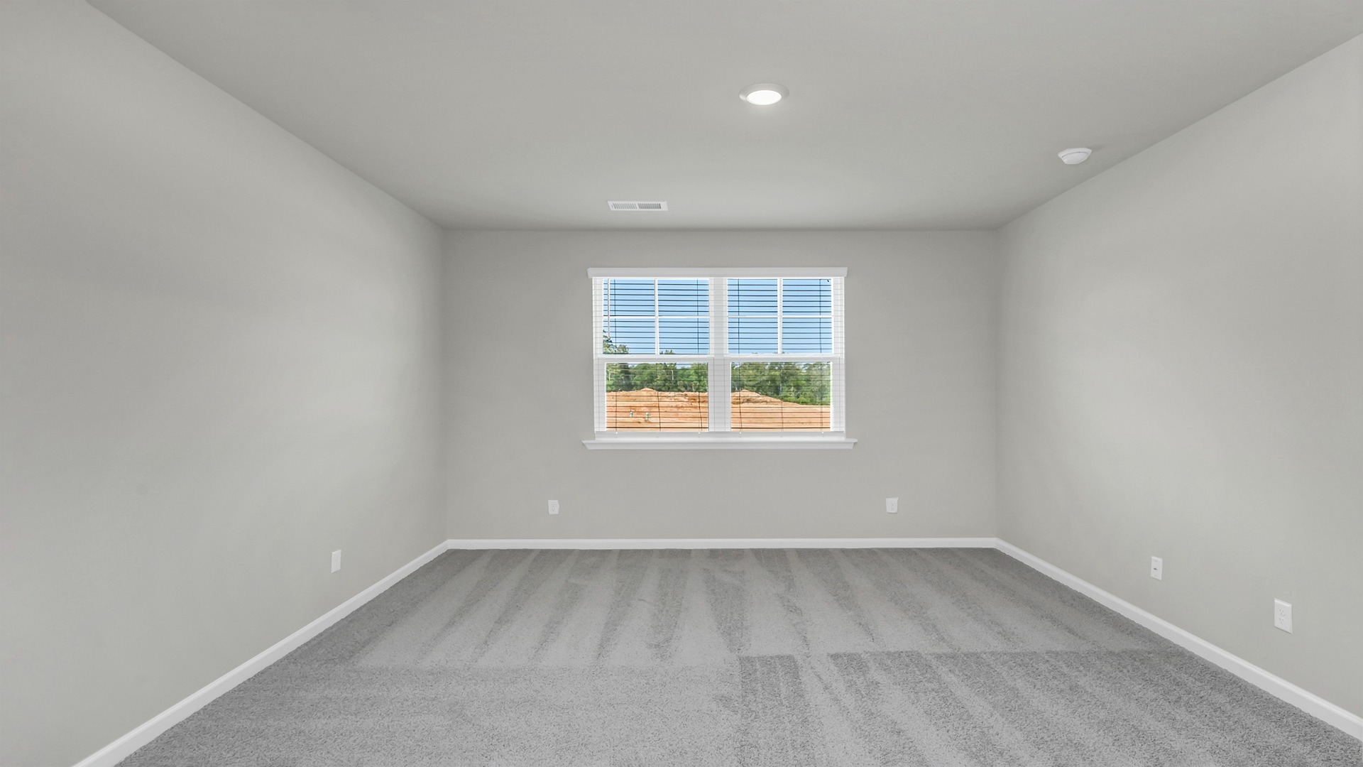 Large primary bedroom on first floor of new home for sale in Leatherstone