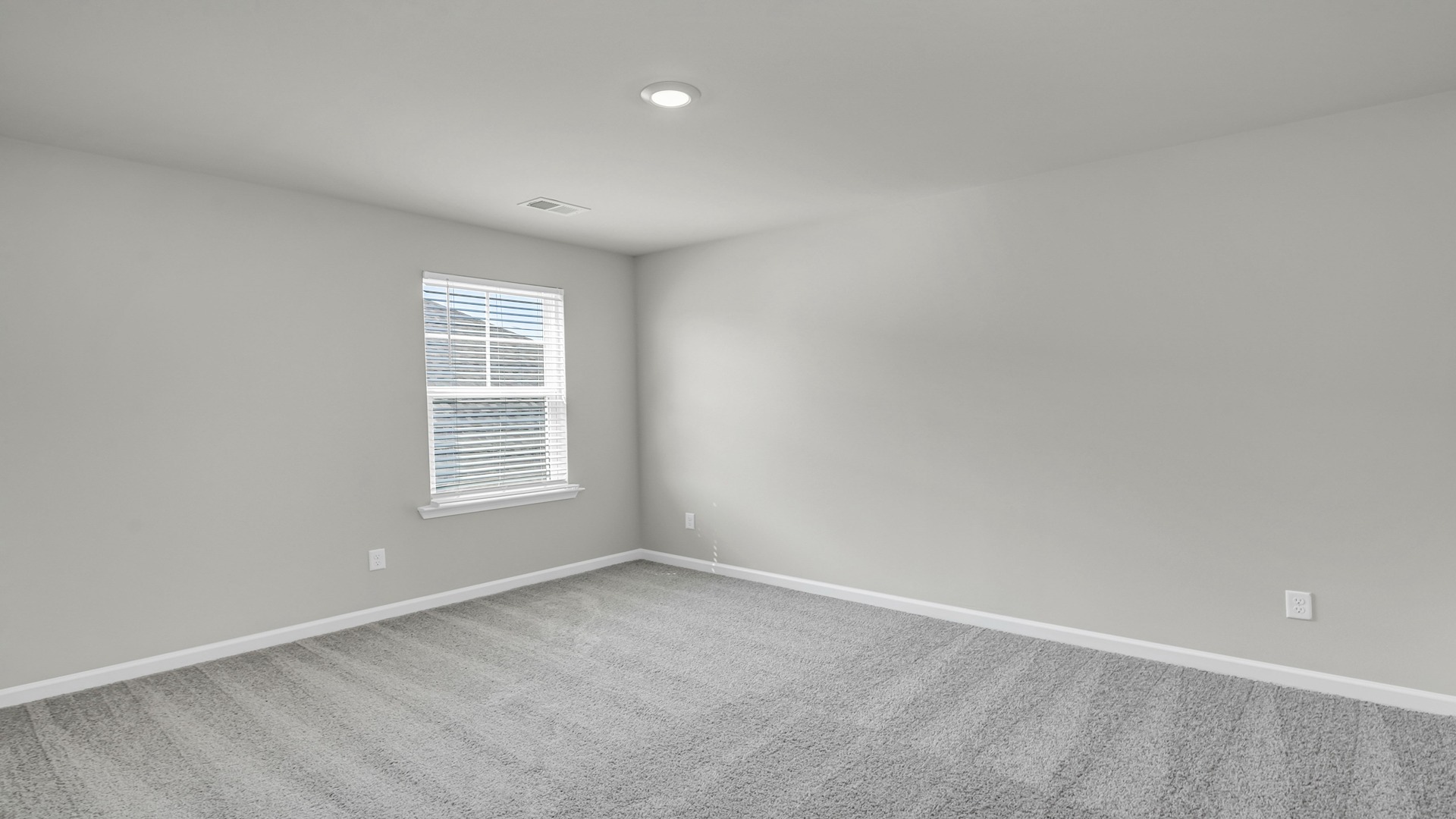 Bedroom 3 upstairs with a window for light and plush carpet flooring