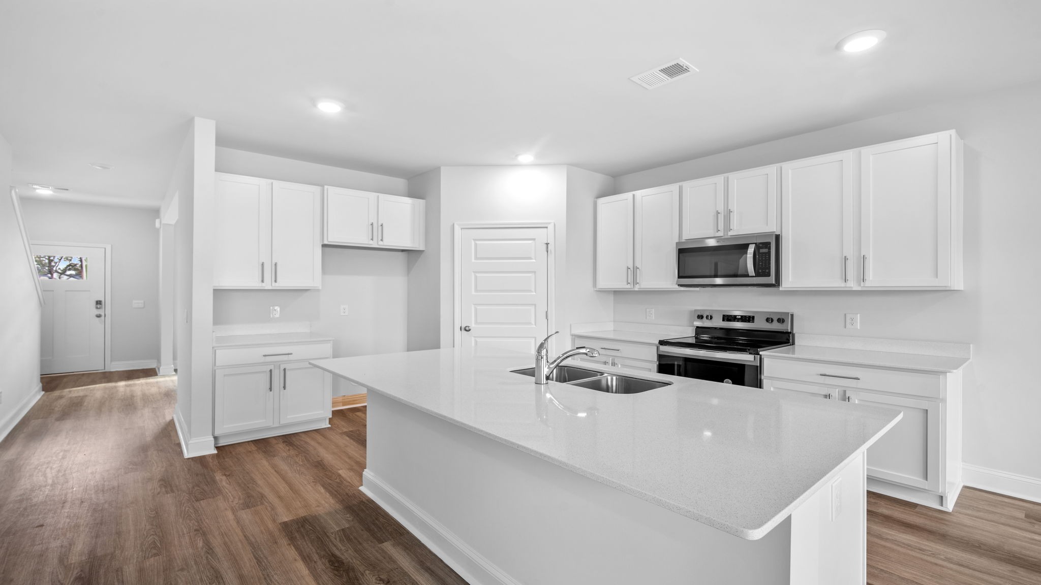 There is a corner pantry in the kitchen and space for seating at the floating kitchen island.