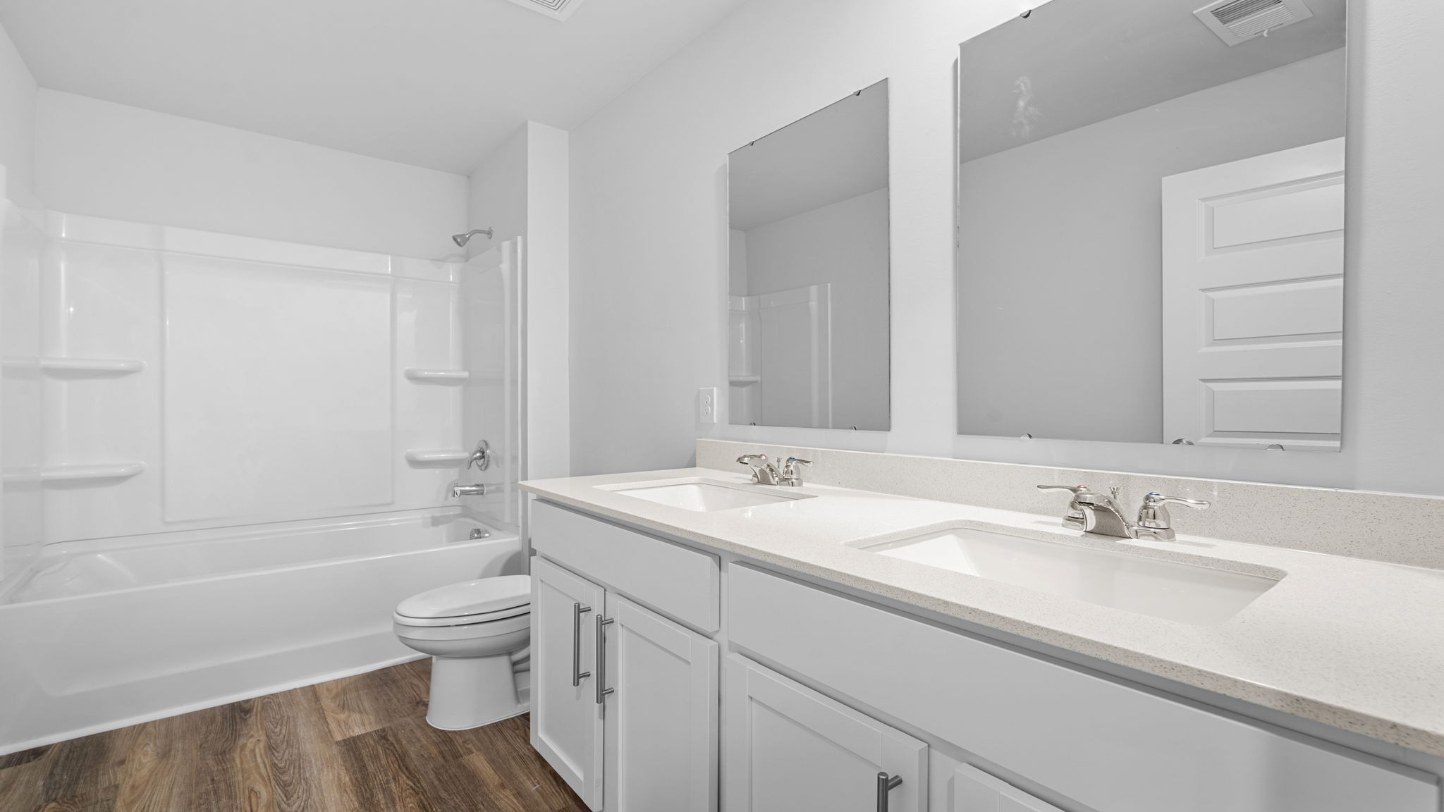 Bathroom 2 is upstairs with double sinks and a shower/tub combo.