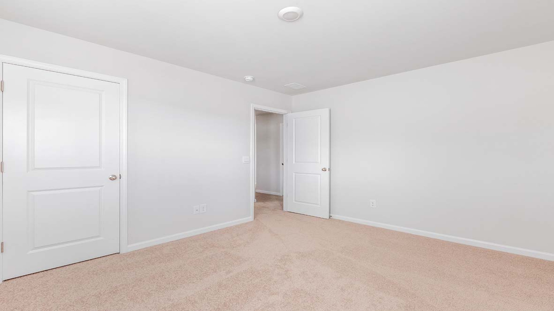 Bedroom 2 is upstairs with carpet floors and 2 windows.