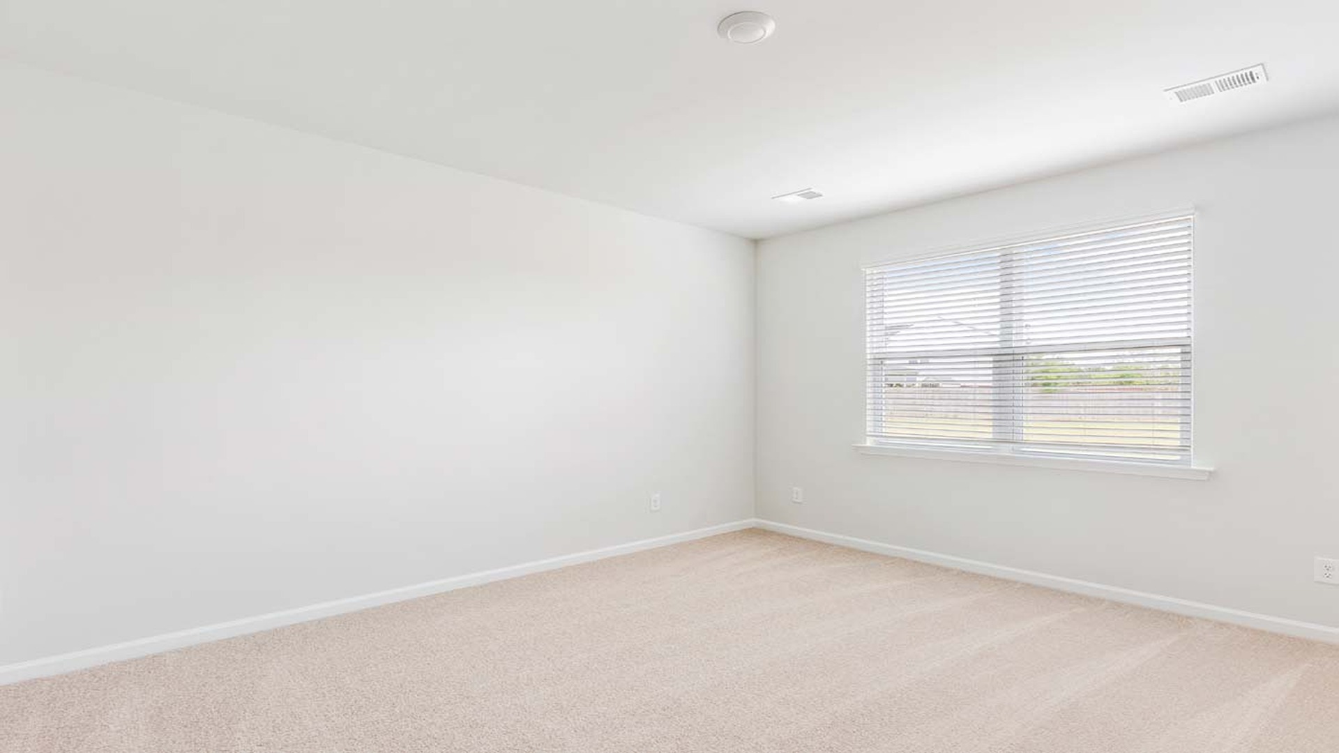 The primary bedroom is downstairs with a large window for light.