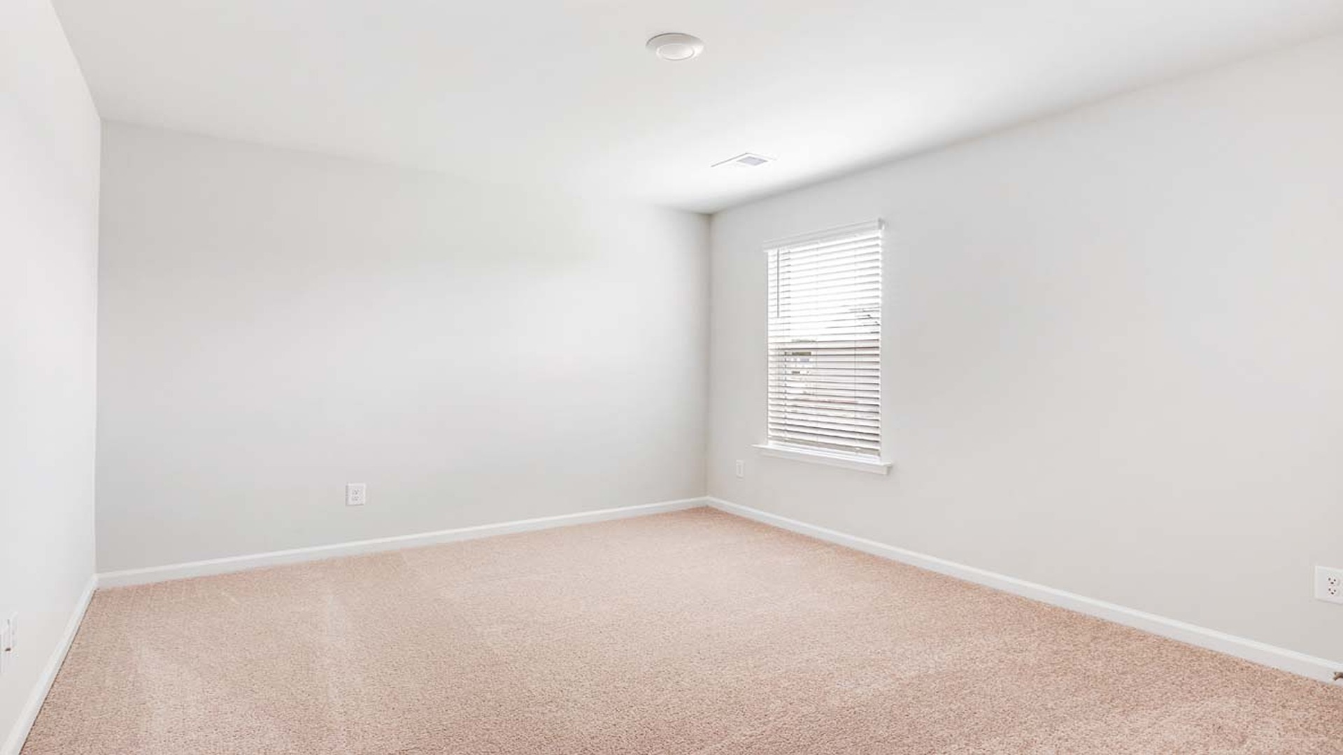 Bedroom 4 is also upstairs with carpet flooring and a window.