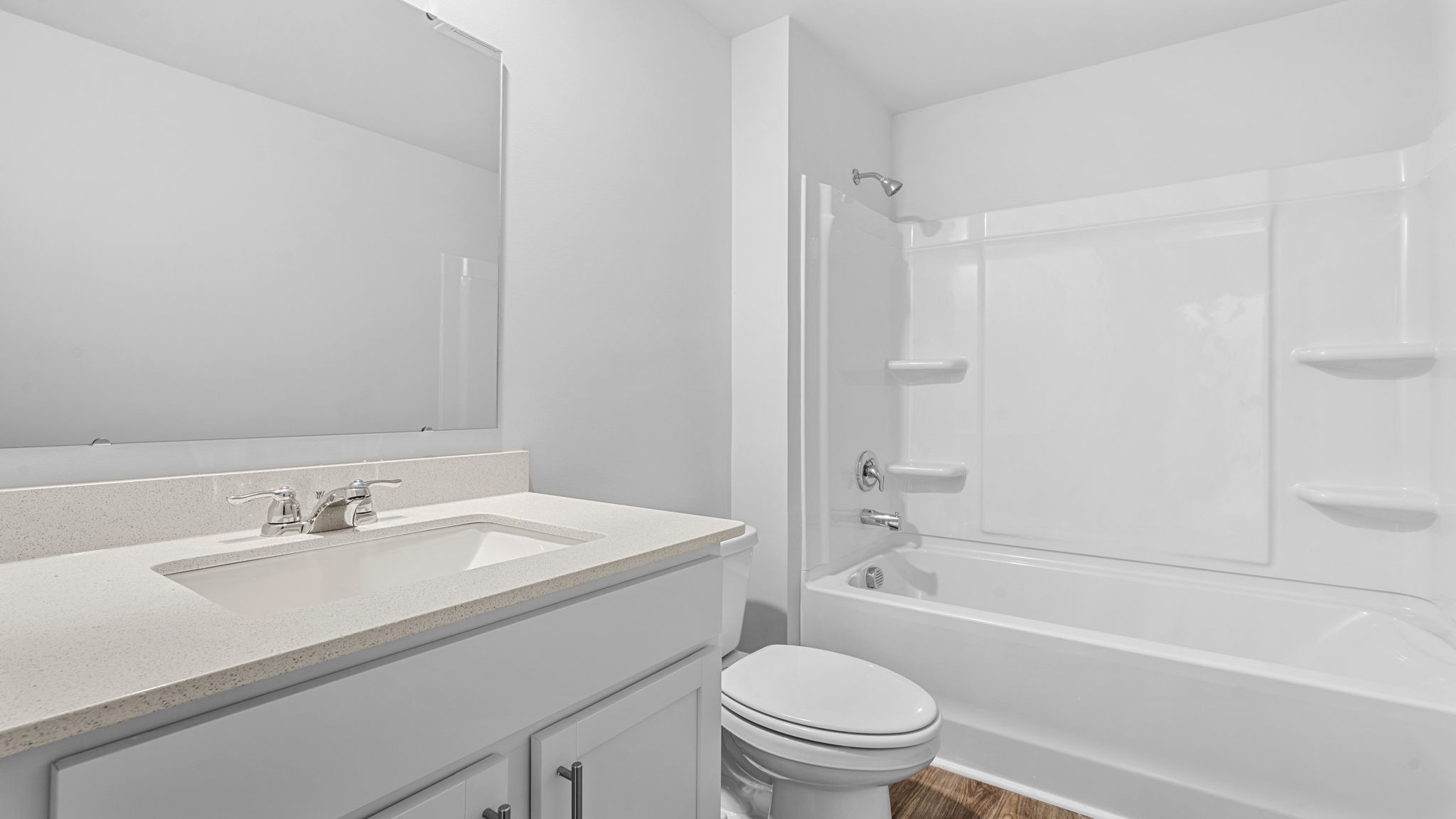 Bathroom 2 is upstairs with a double vanity and shower/tub combo.