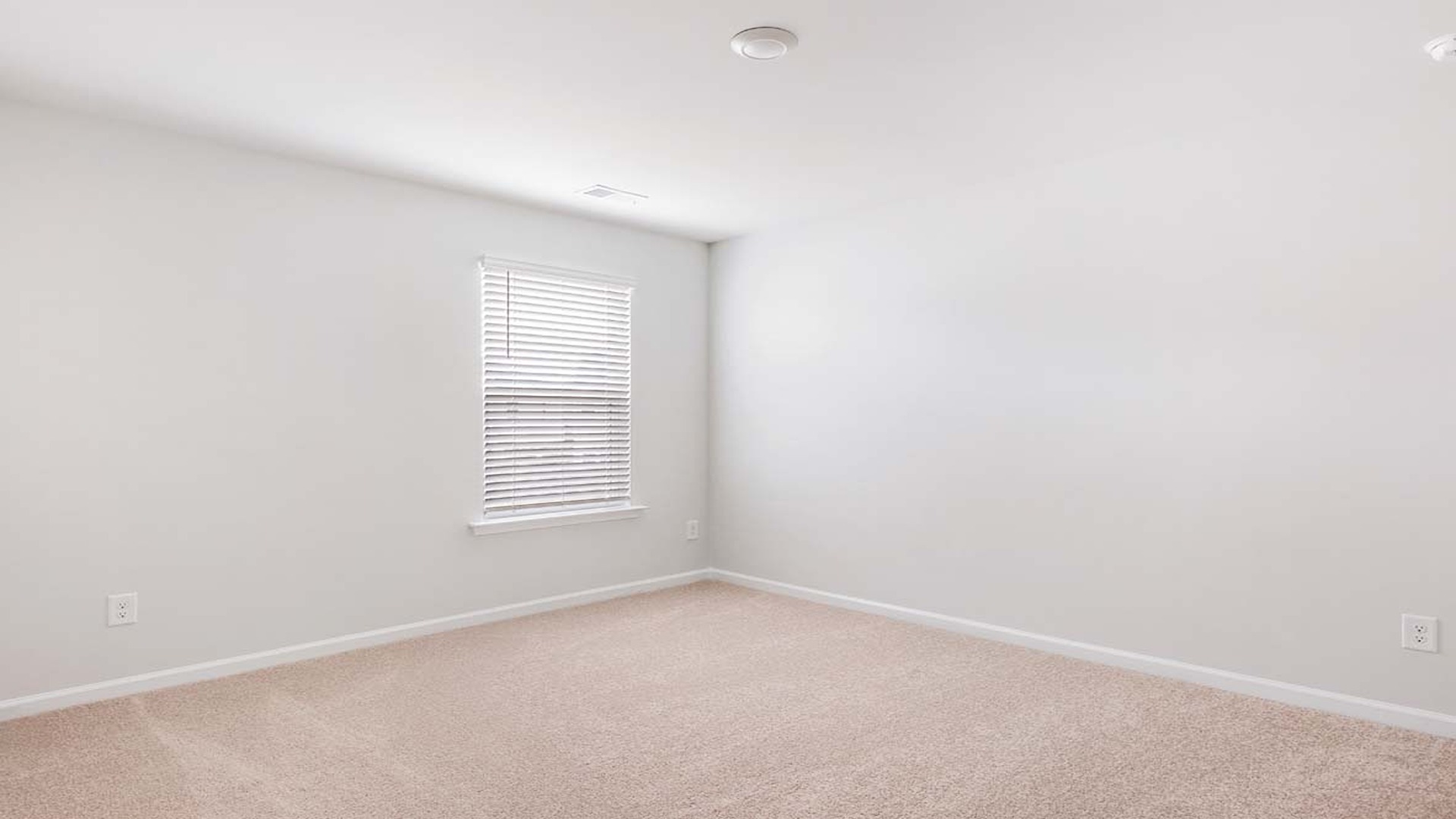 Bedroom 3 upstairs with carpet flooring and a window.