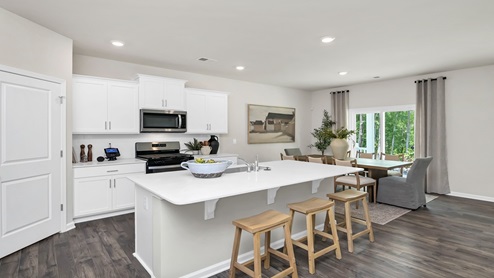 Hayden kitchen with white quartz countertops and white cabinetry.