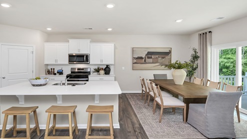The dining and kitchen areas are open concept.