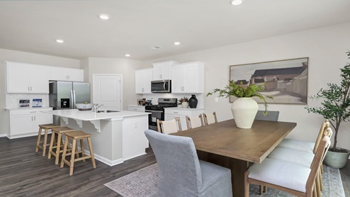 The dining and kitchen areas are open concept.