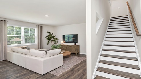 The floating kitchen island overlooks the living area and stairway to upstairs.