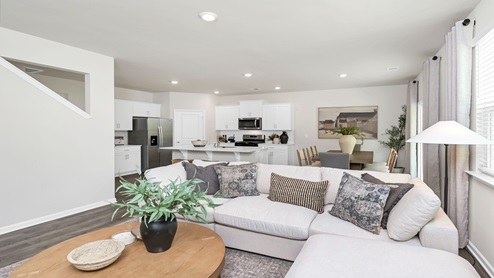 The dining, living, kitchen areas are open concept design finished with Revwood flooring.