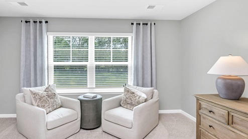 The Primary bedroom is carpeted and located upstairs.