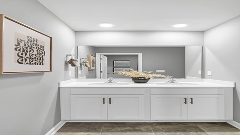 Bathroom 3 features double sinks and is located between bedrooms 3 and 4.