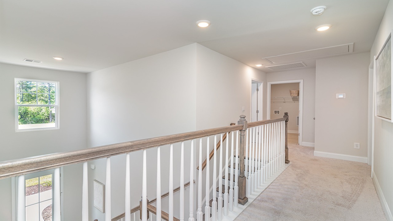 Stair railing overlooking the first floor of the Forrester floor plan for sale in Blythewood, SC