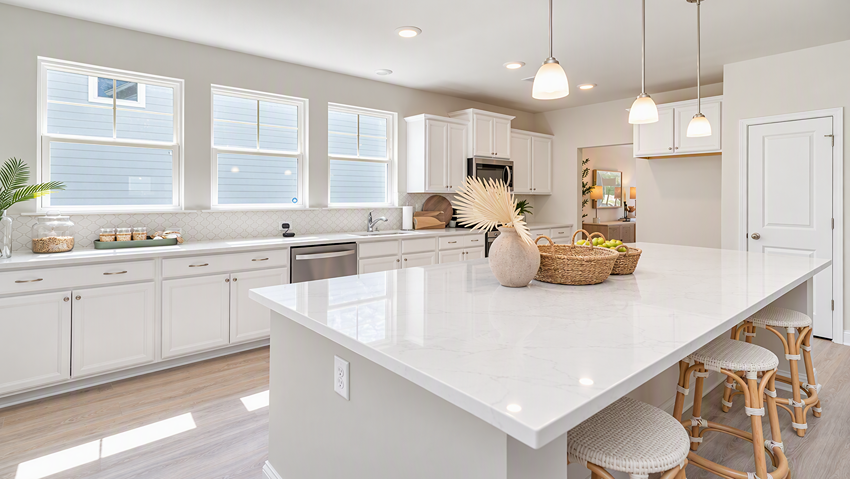 Quartz countertops and lots of natural light in kitchen of new construction home for sale