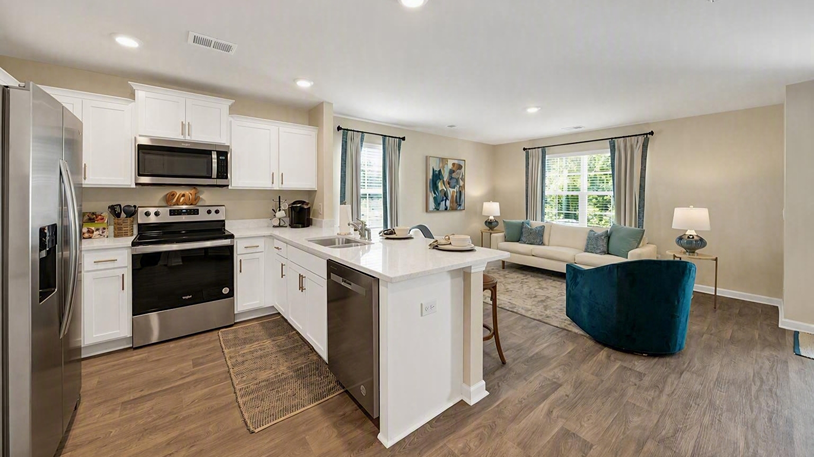Pearson kitchen and living areas with matching vinyl floors