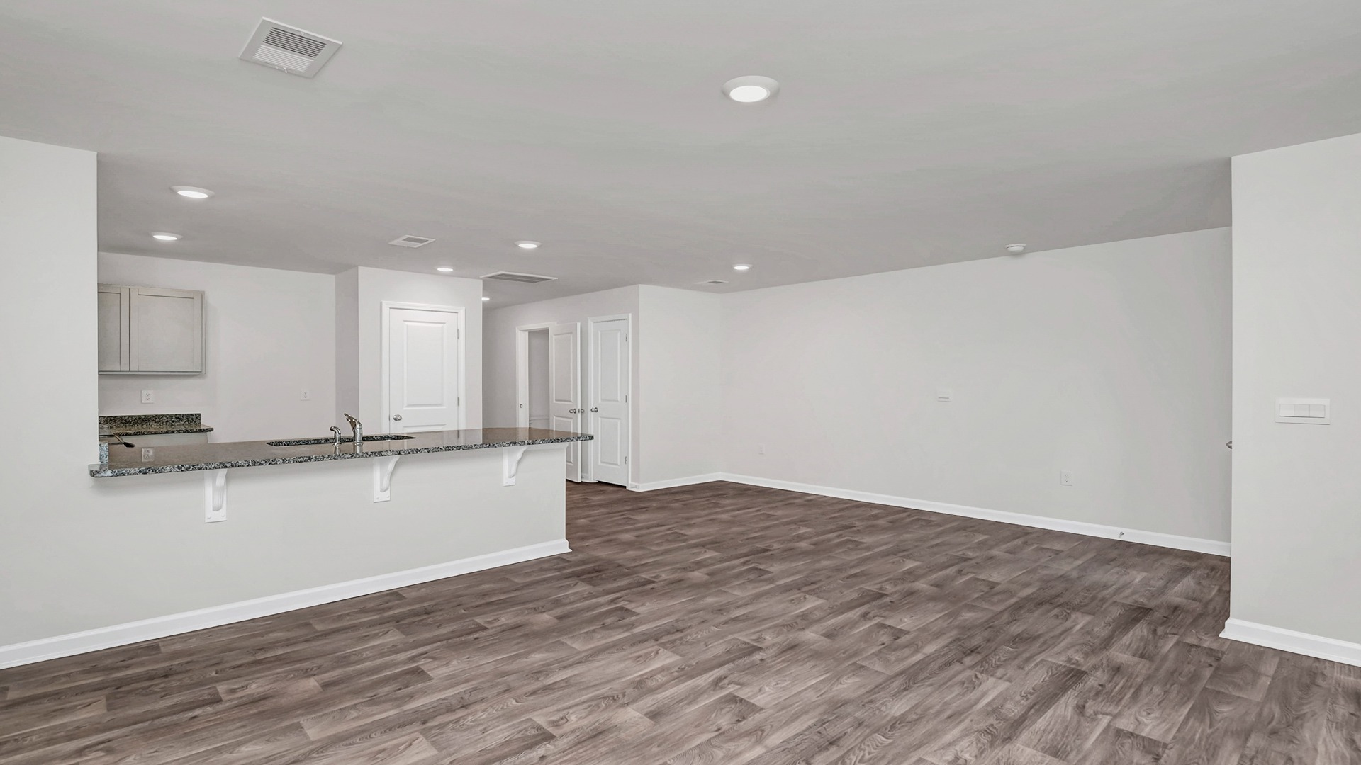 Modern kitchen and eat-in dining area in new construction townhome for sale in Hopkins