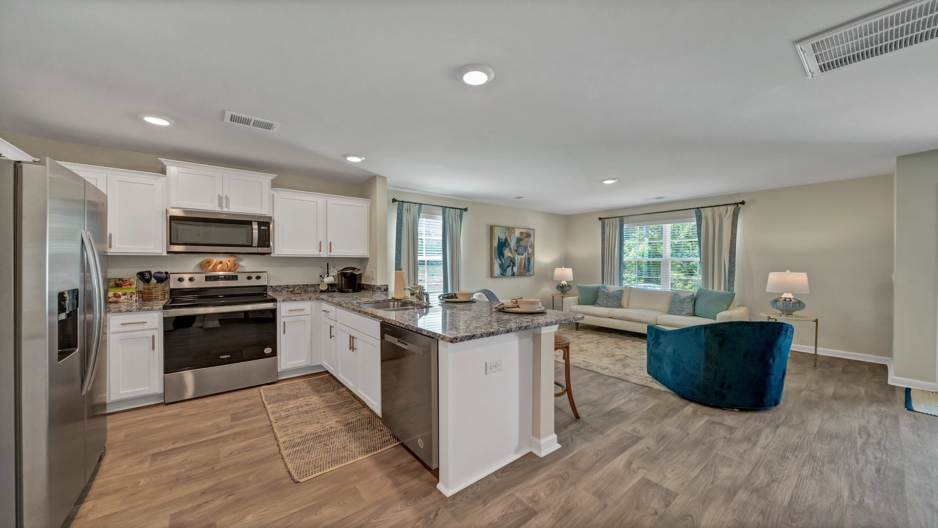 Open concept first floor extends from the front foyer