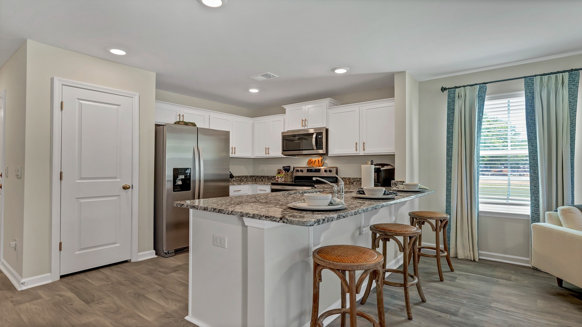 Pearson townhome kitchen with a bar and space for barstool seating