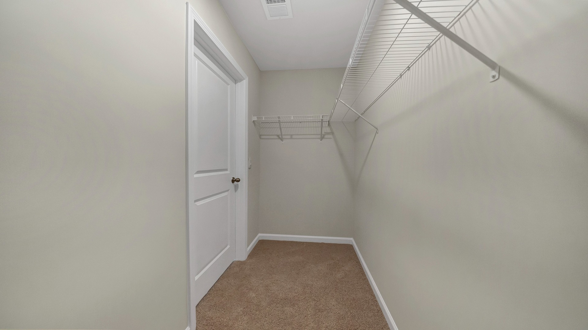 Walk-in primary closet in the bedroom