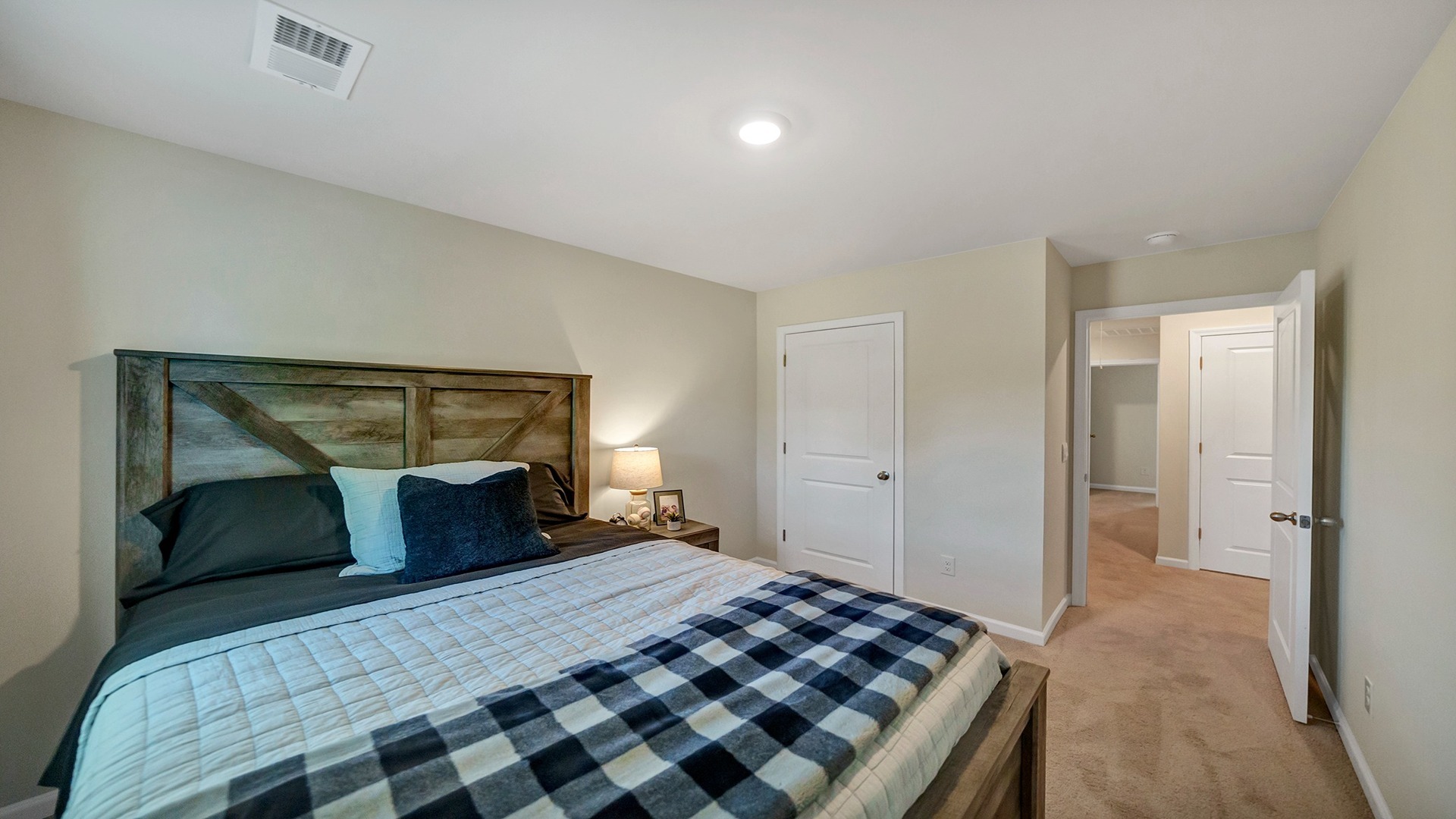 Bedroom 3 upstairs with carpet flooring and a private closet
