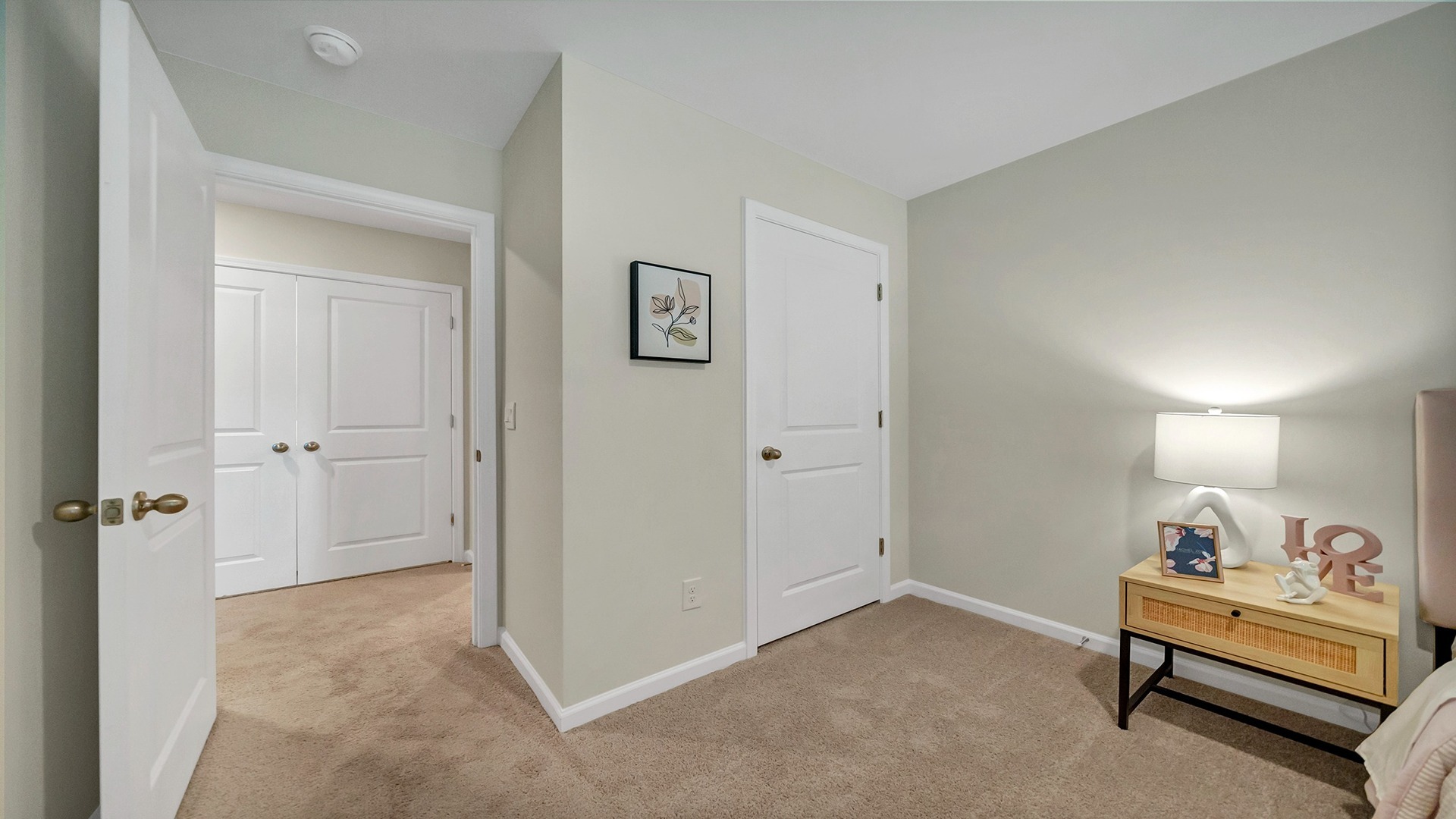 Bedroom 2 upstairs with carpet flooring and a private closet
