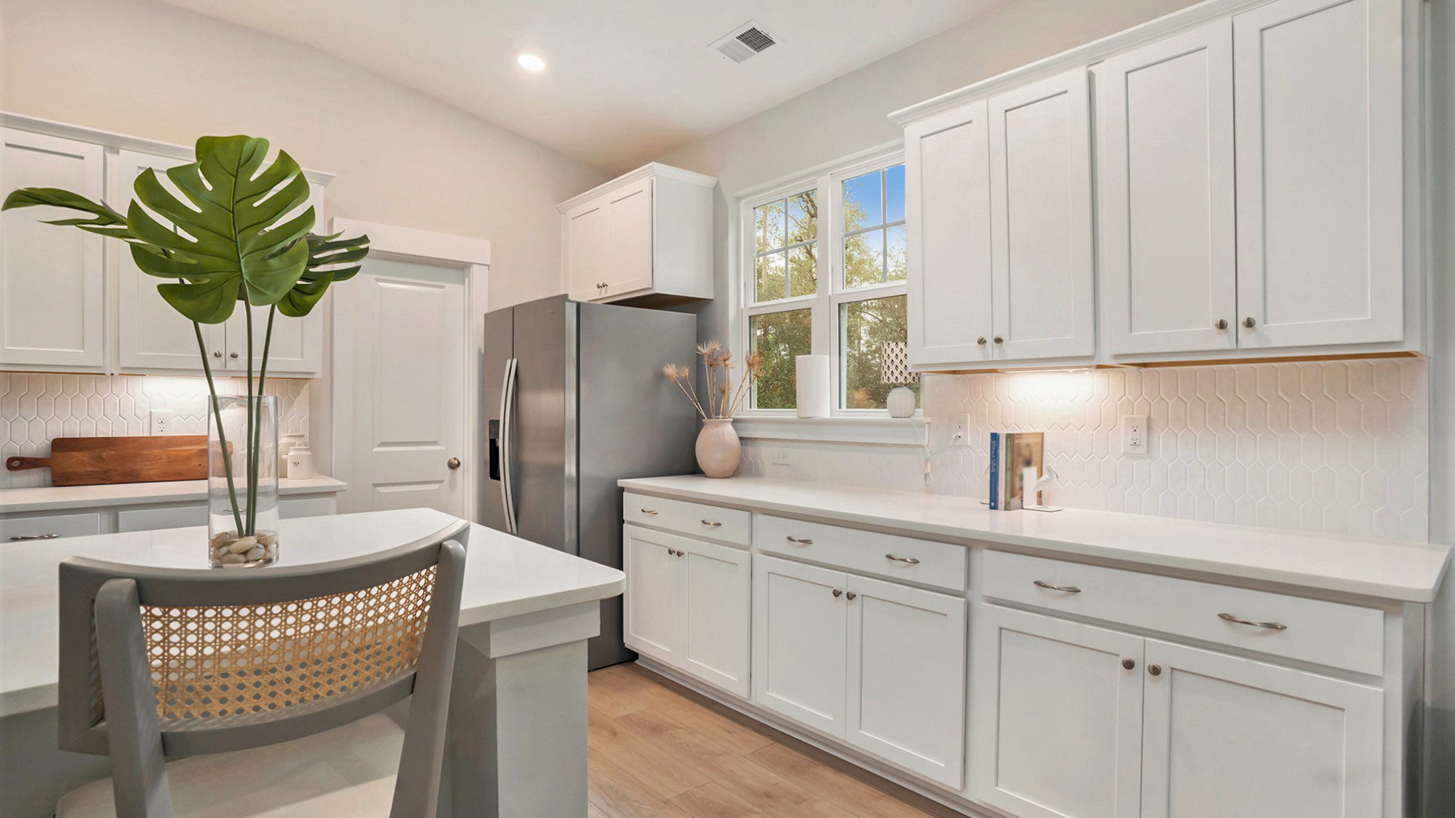 Stylish tile backsplash finishes the kitchen space of new home in Irmo, SC 55+ community