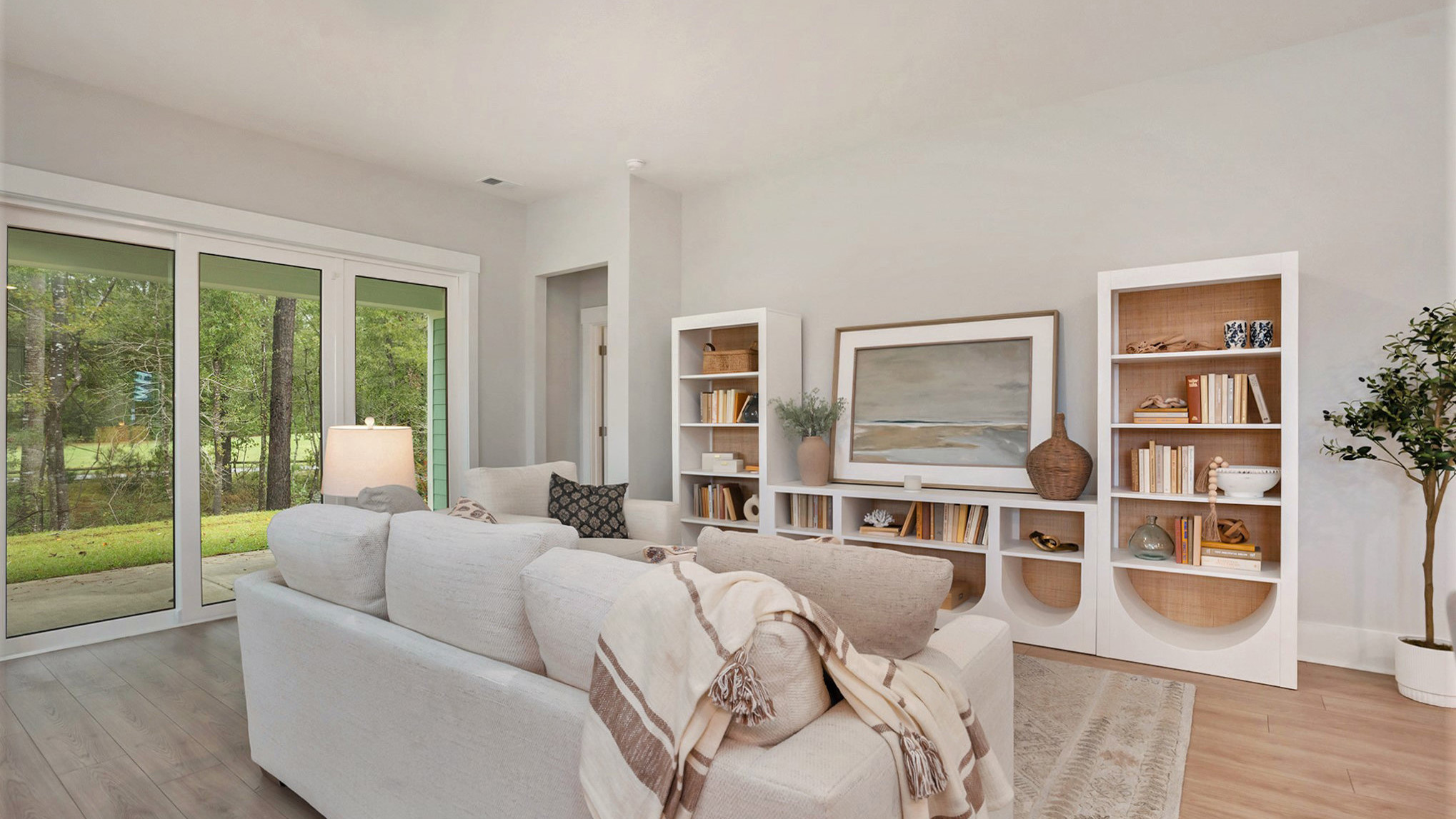 Living area in new construction home in a 55+ age restricted community with lots of natural light
