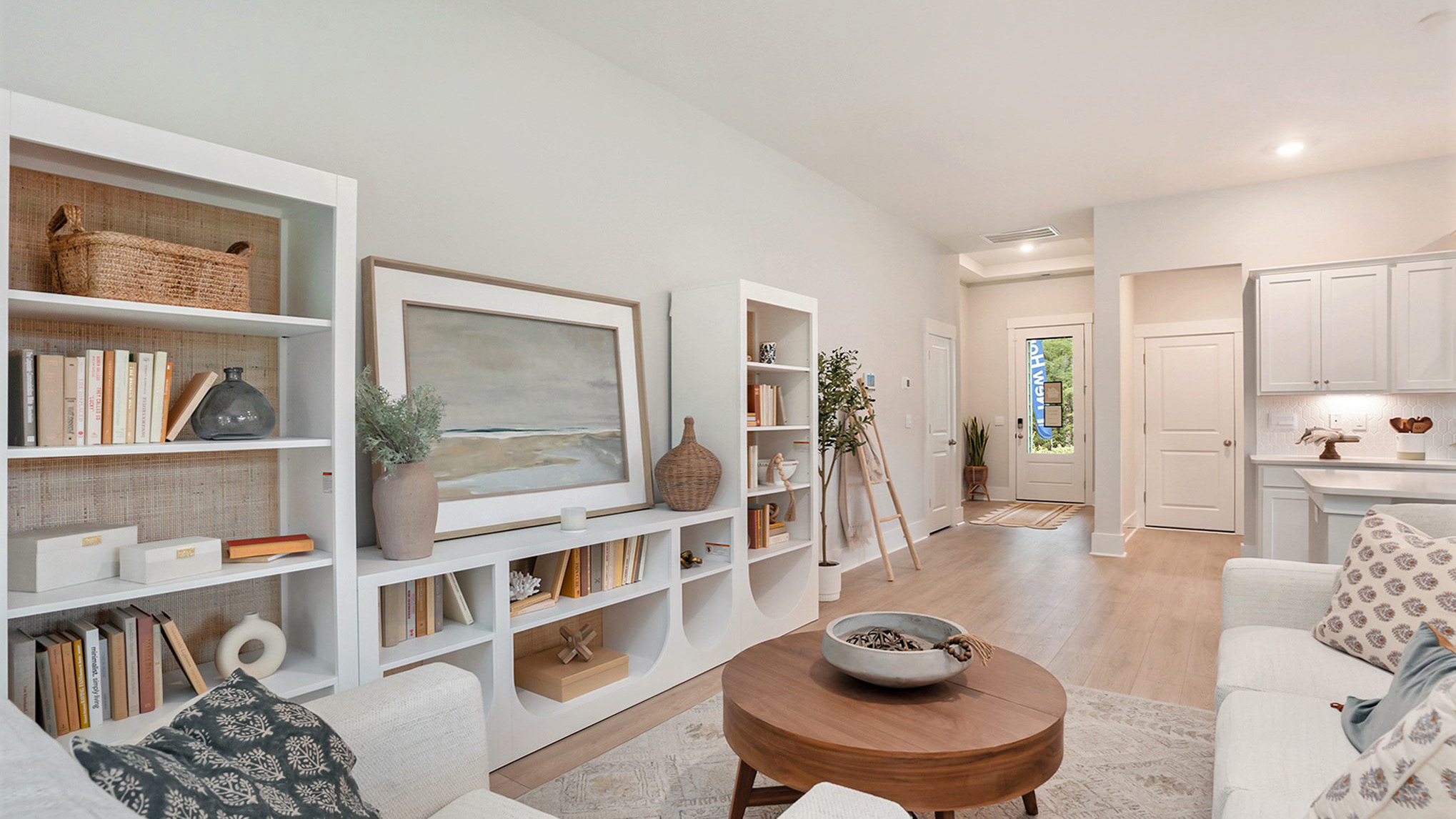 View of front door and foyer from the living area of the Eaton floorplan