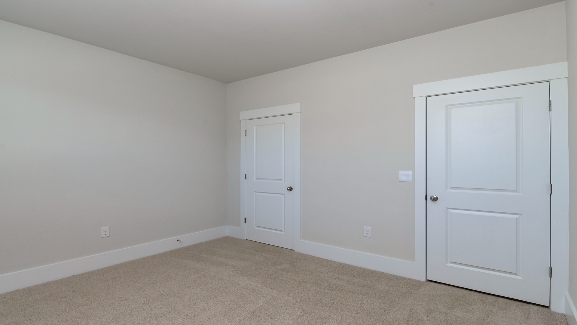 Carpet floors in secondary Bradford bedroom and a private closet
