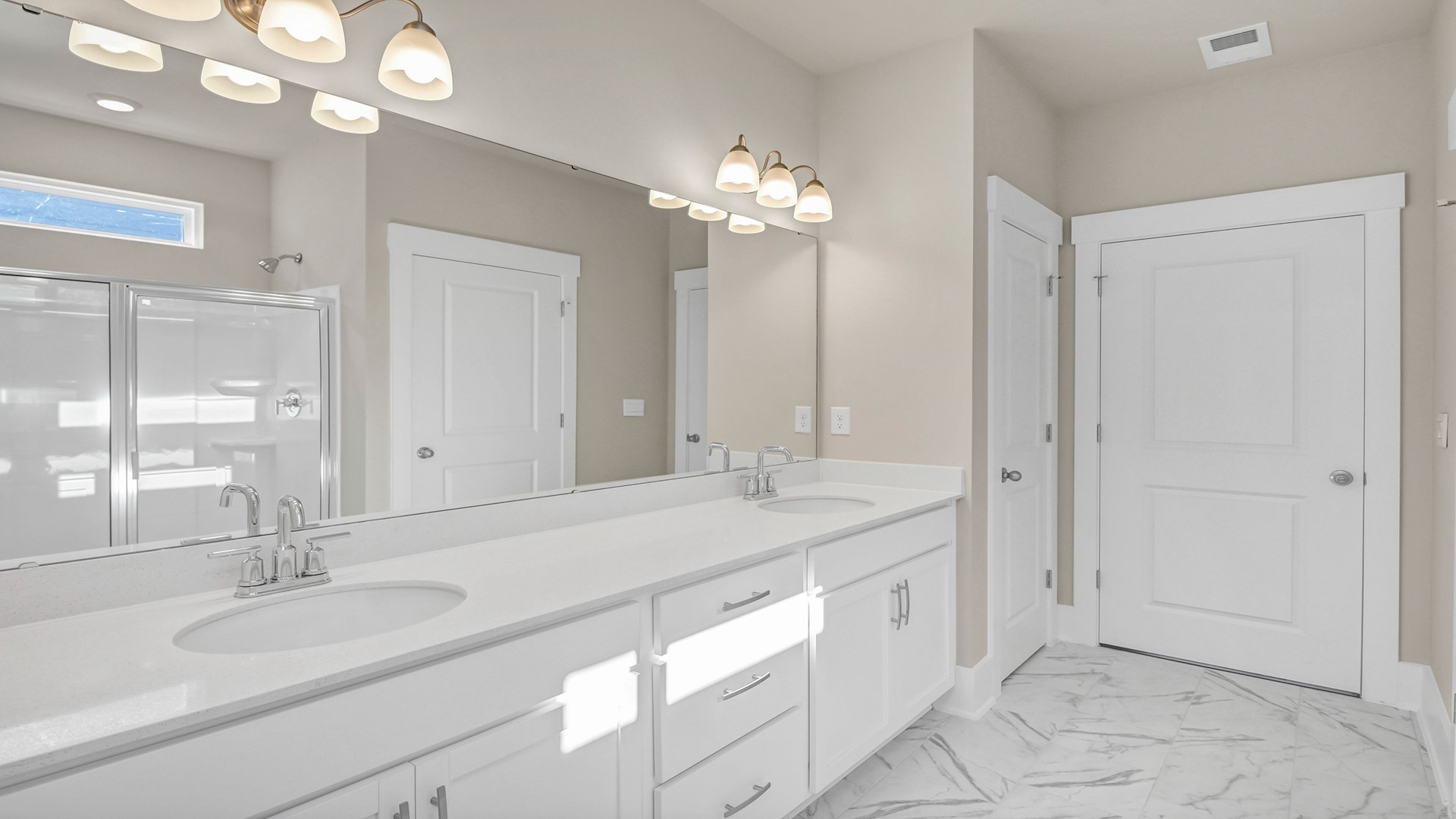 Tile flooring in the primary bathroom of the Bradford for sale in Dorset Ridge