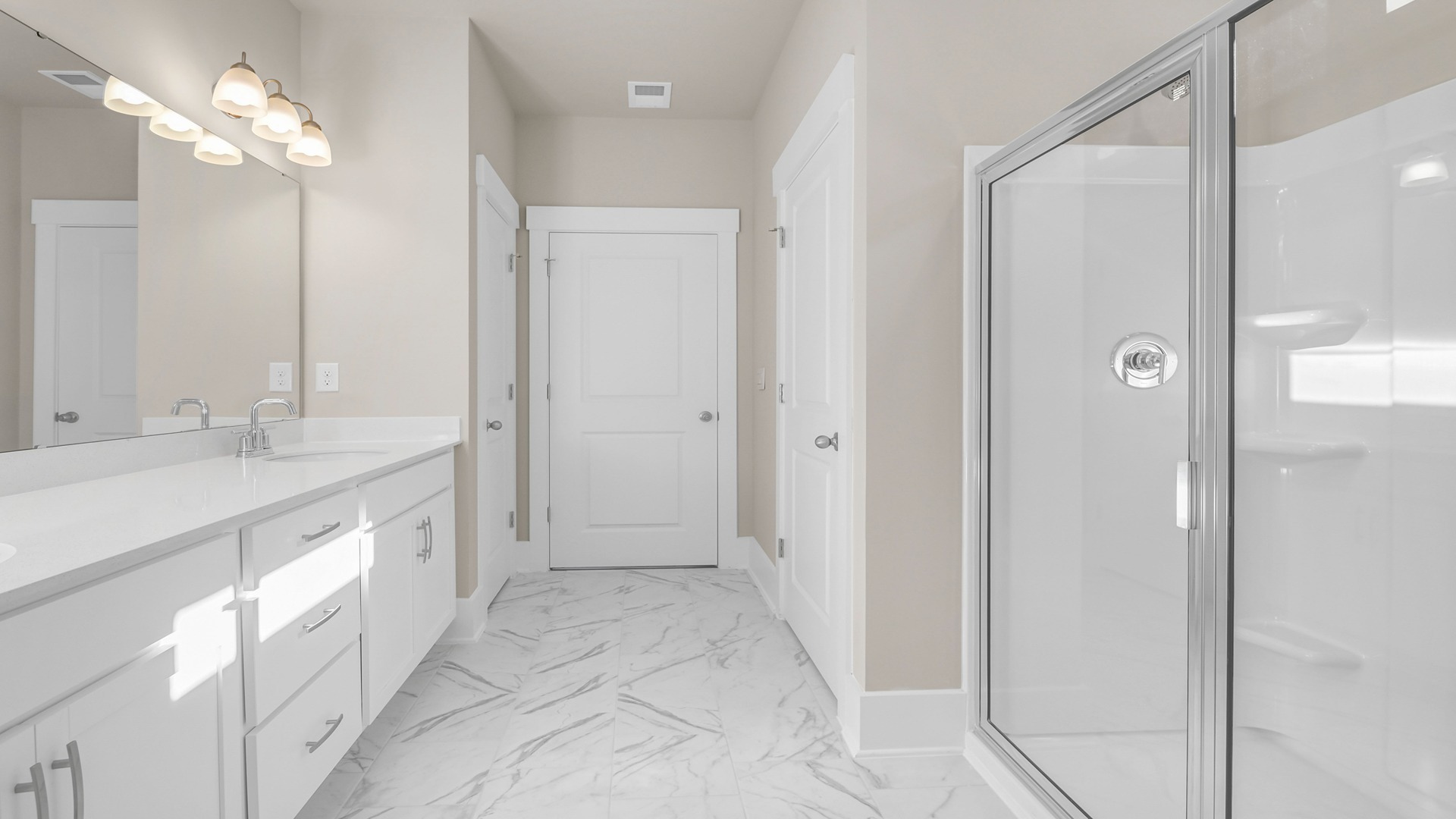 Standup, glass front shower in the primary bathroom of new home available