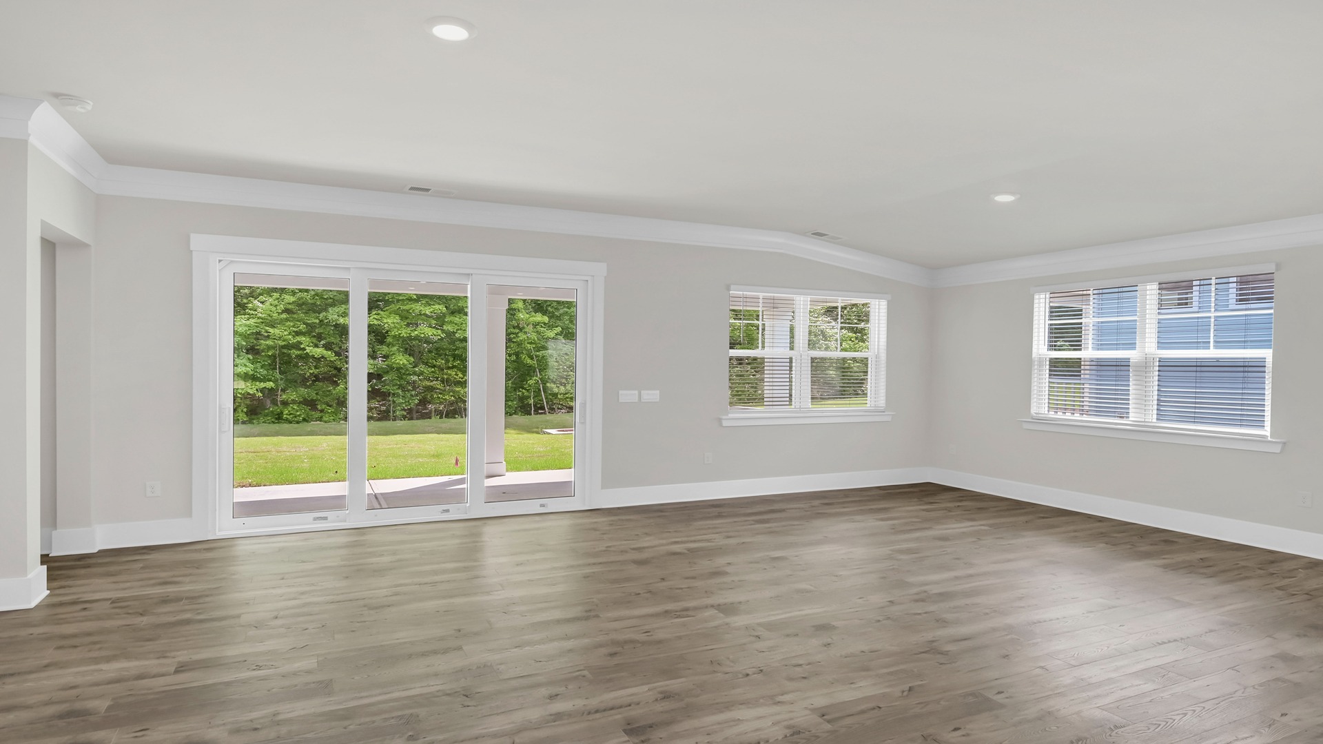 Open concept dining and living areas with lots of windows for natural light into the main living areas of the Eaton