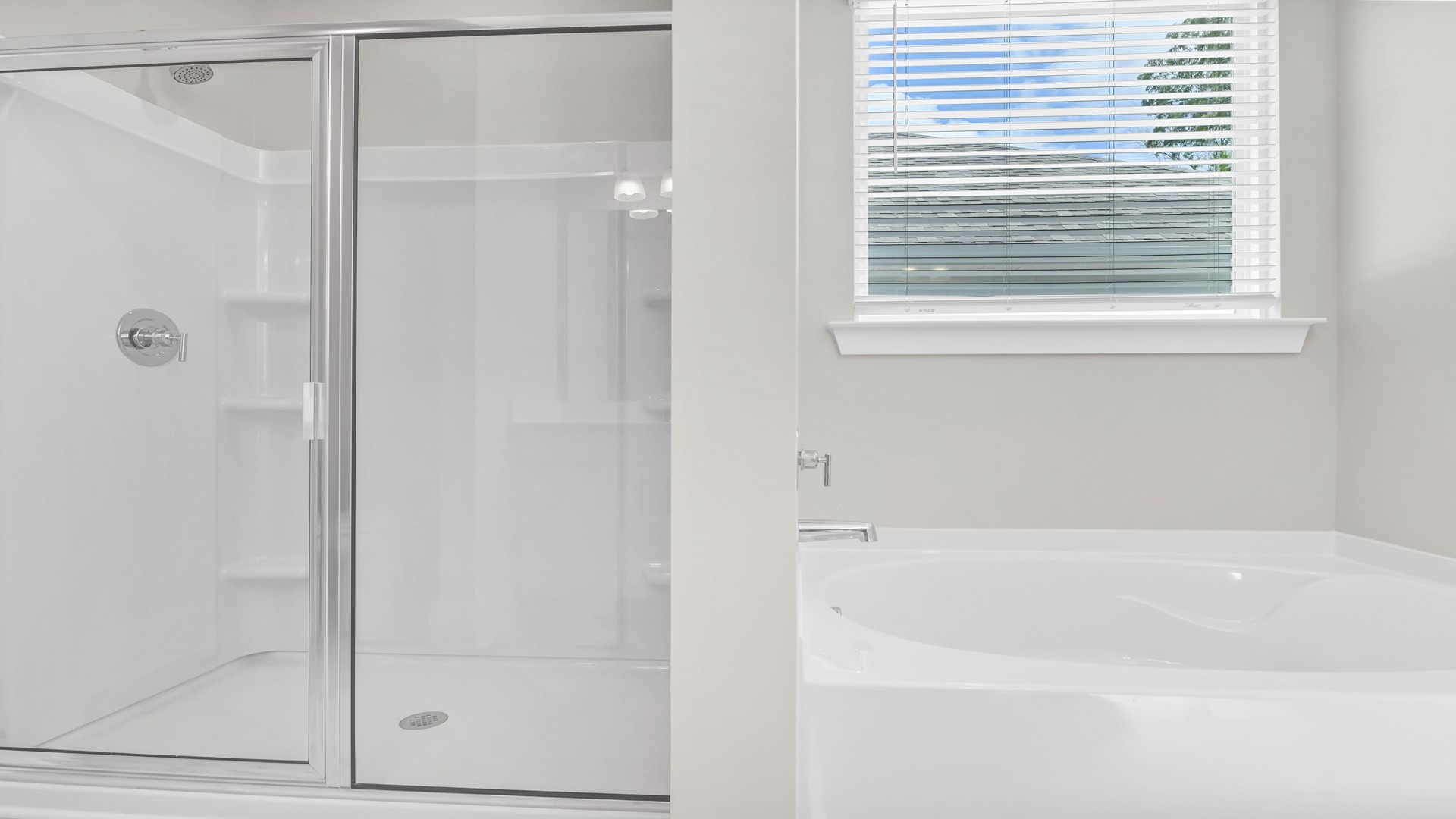 Walk-in primary shower and optional garden tub in the Eaton floor plan primary bathroom